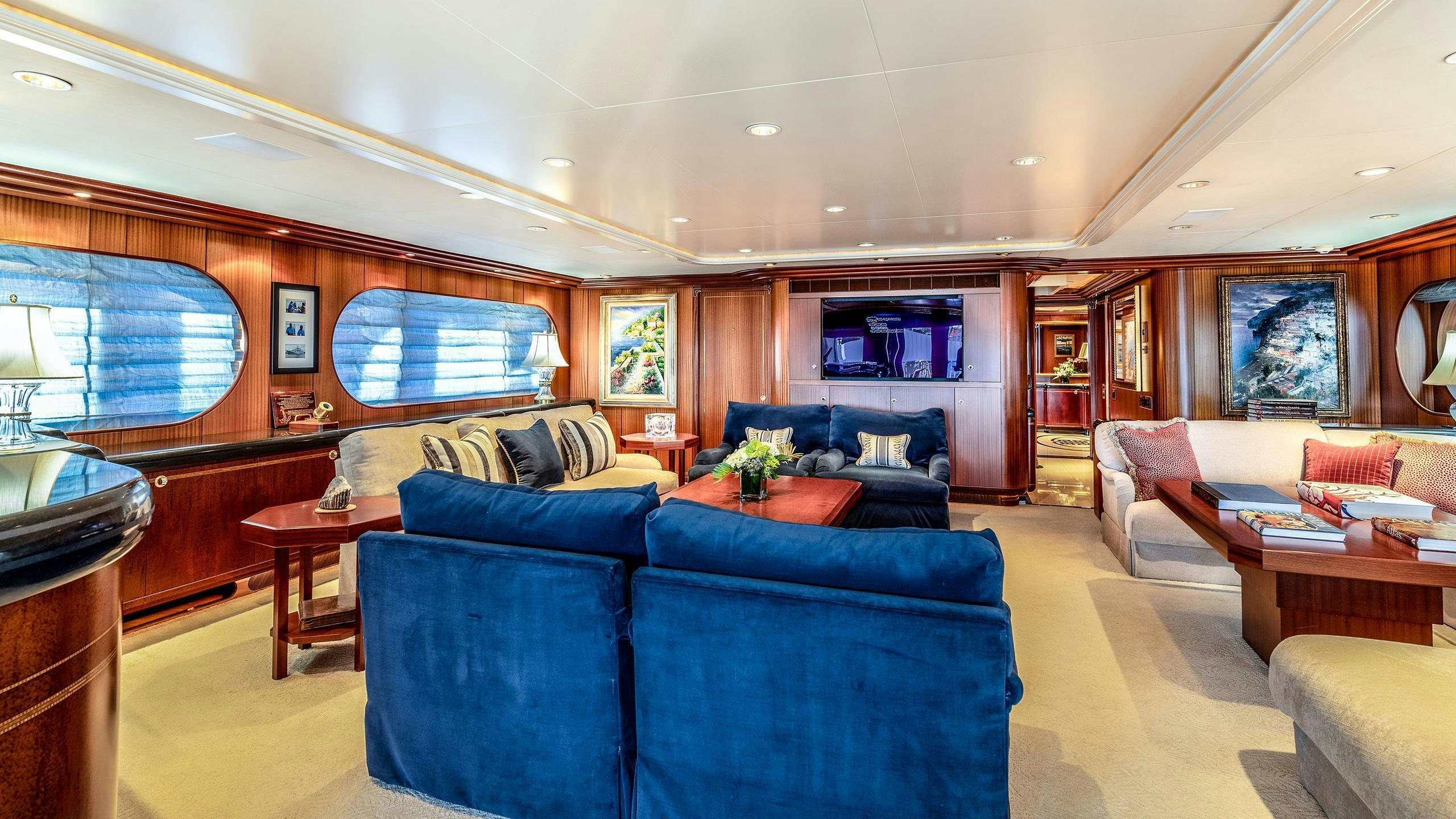 a living room with a couch and a table aboard NEVER ENOUGH Yacht for Charter