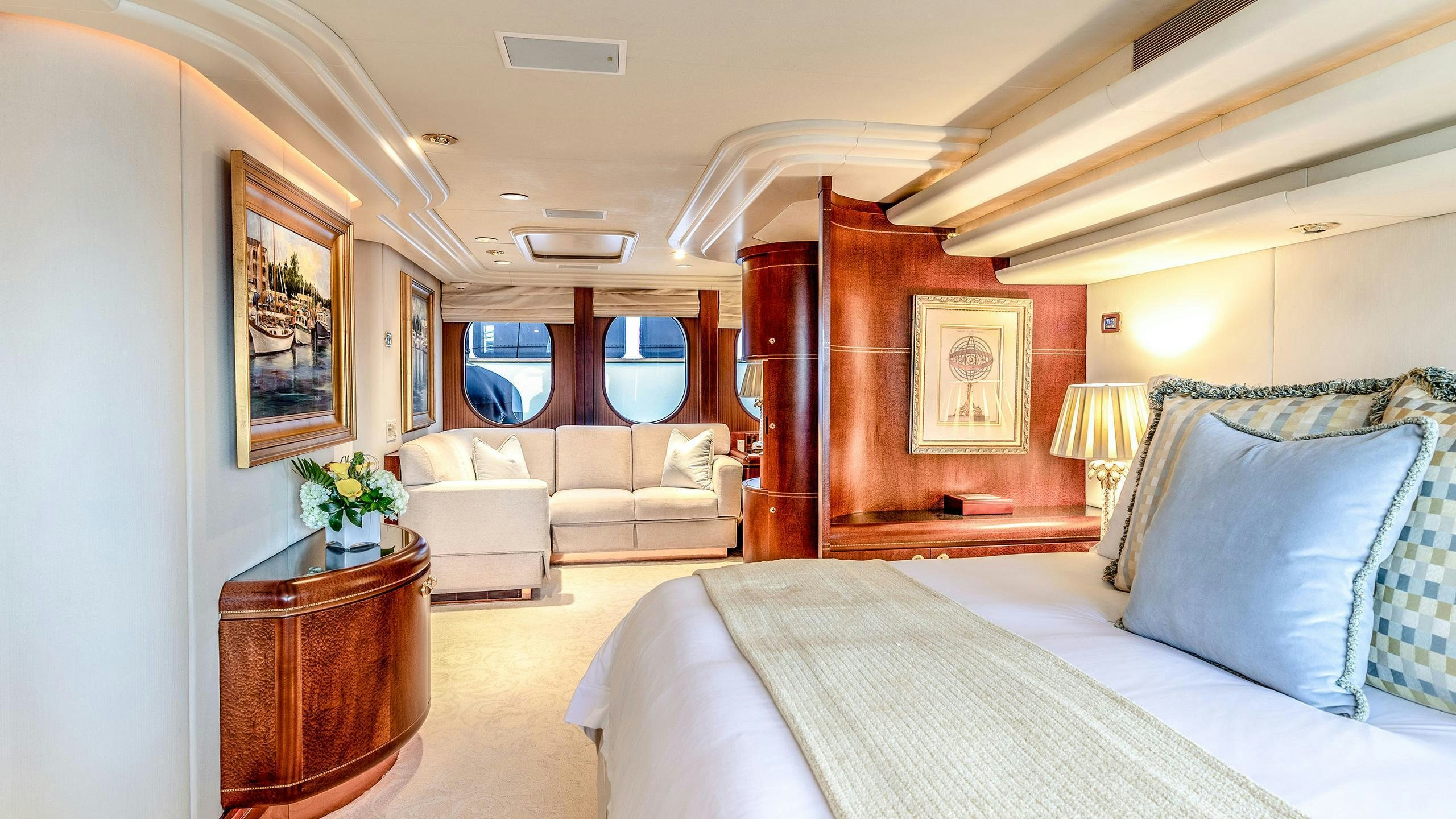 a bedroom with a bed and a desk aboard NEVER ENOUGH Yacht for Charter