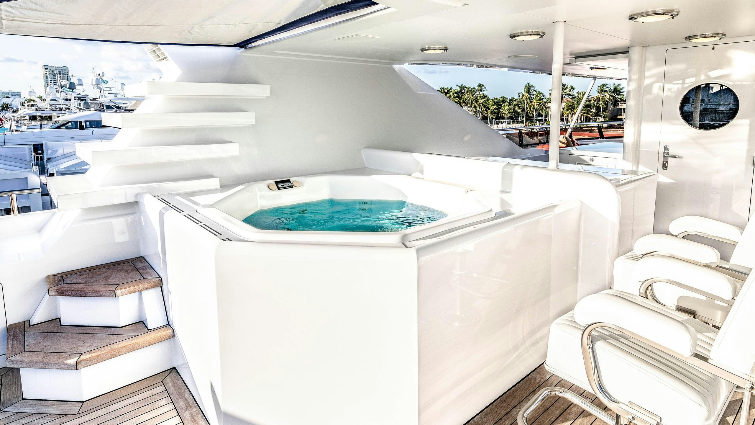 a large white swimming pool aboard NEVER ENOUGH Yacht for Charter
