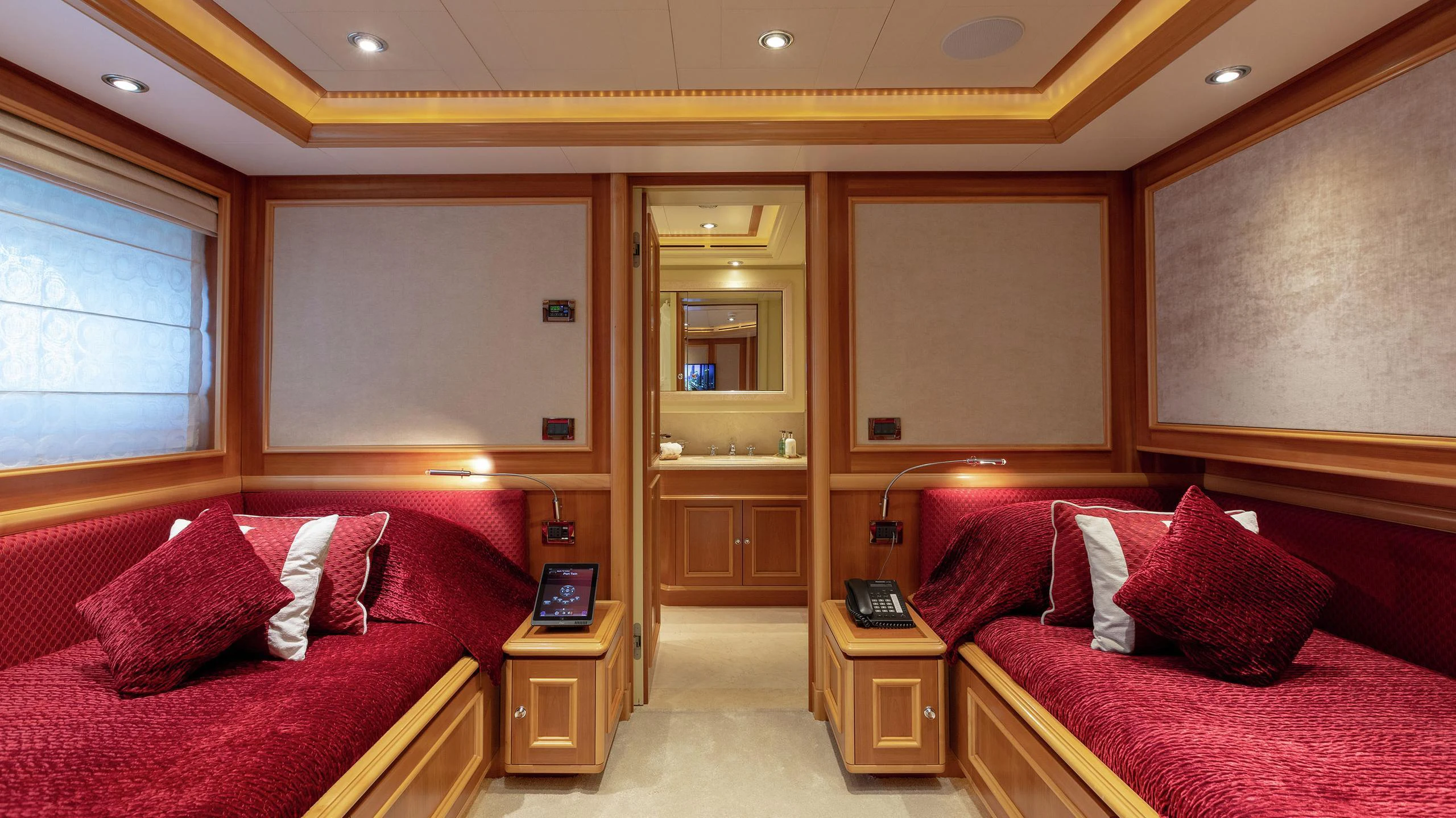 a room with a bed and a couch aboard EMOTION 2 Yacht for Charter