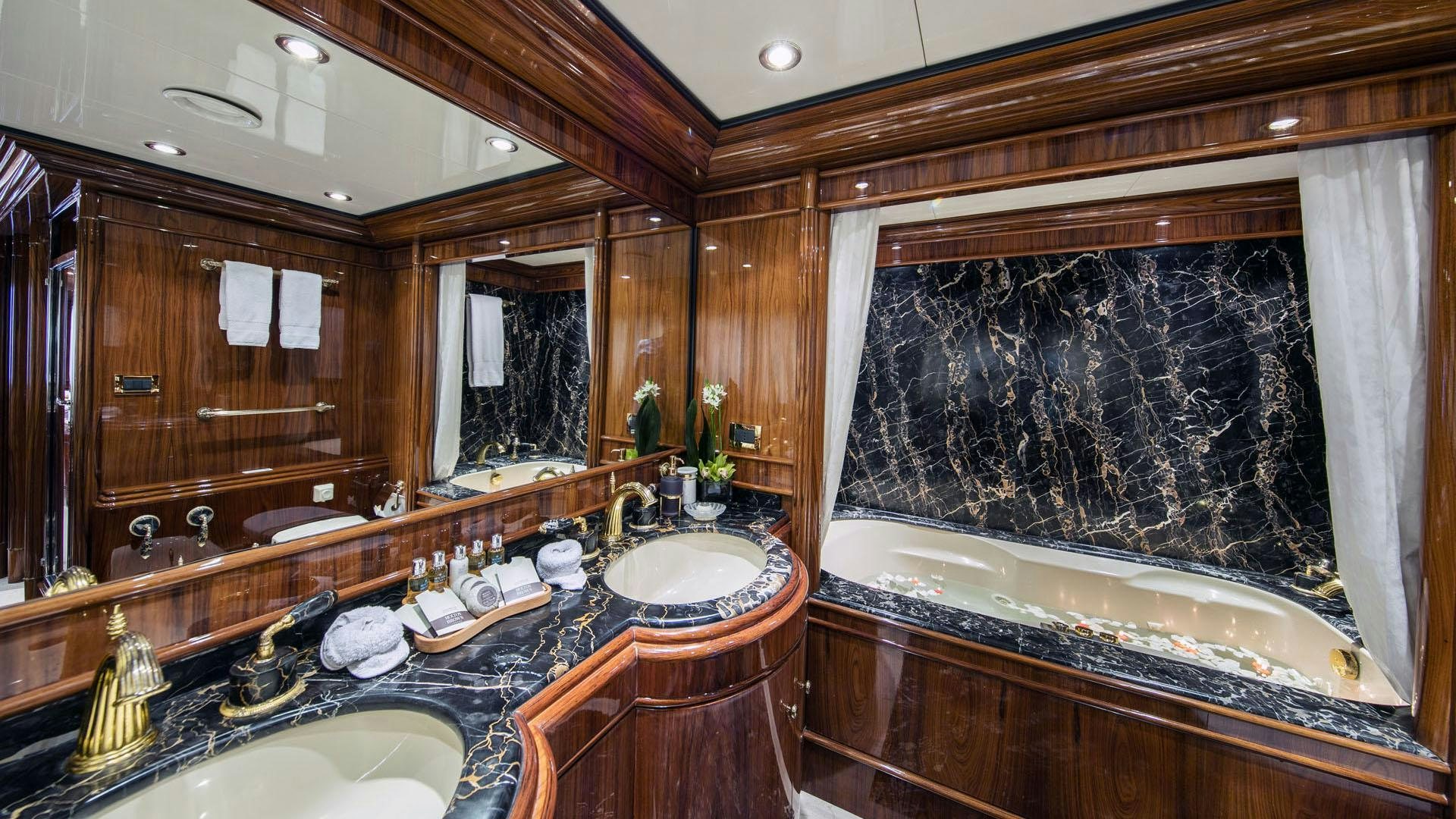 a bathroom with a large mirror aboard JAAN Yacht for Charter
