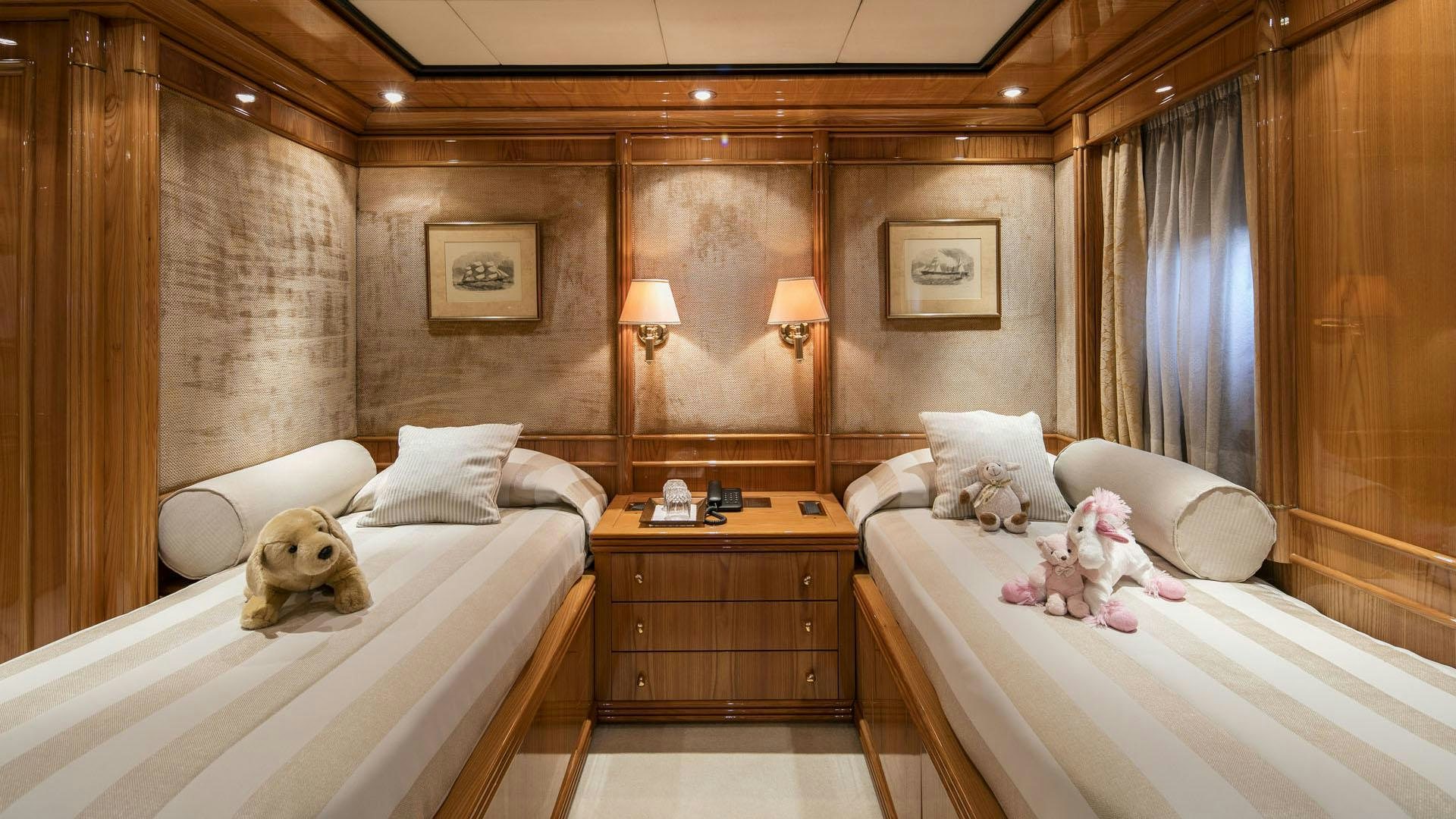 a dog sitting on a bed aboard JAAN Yacht for Charter