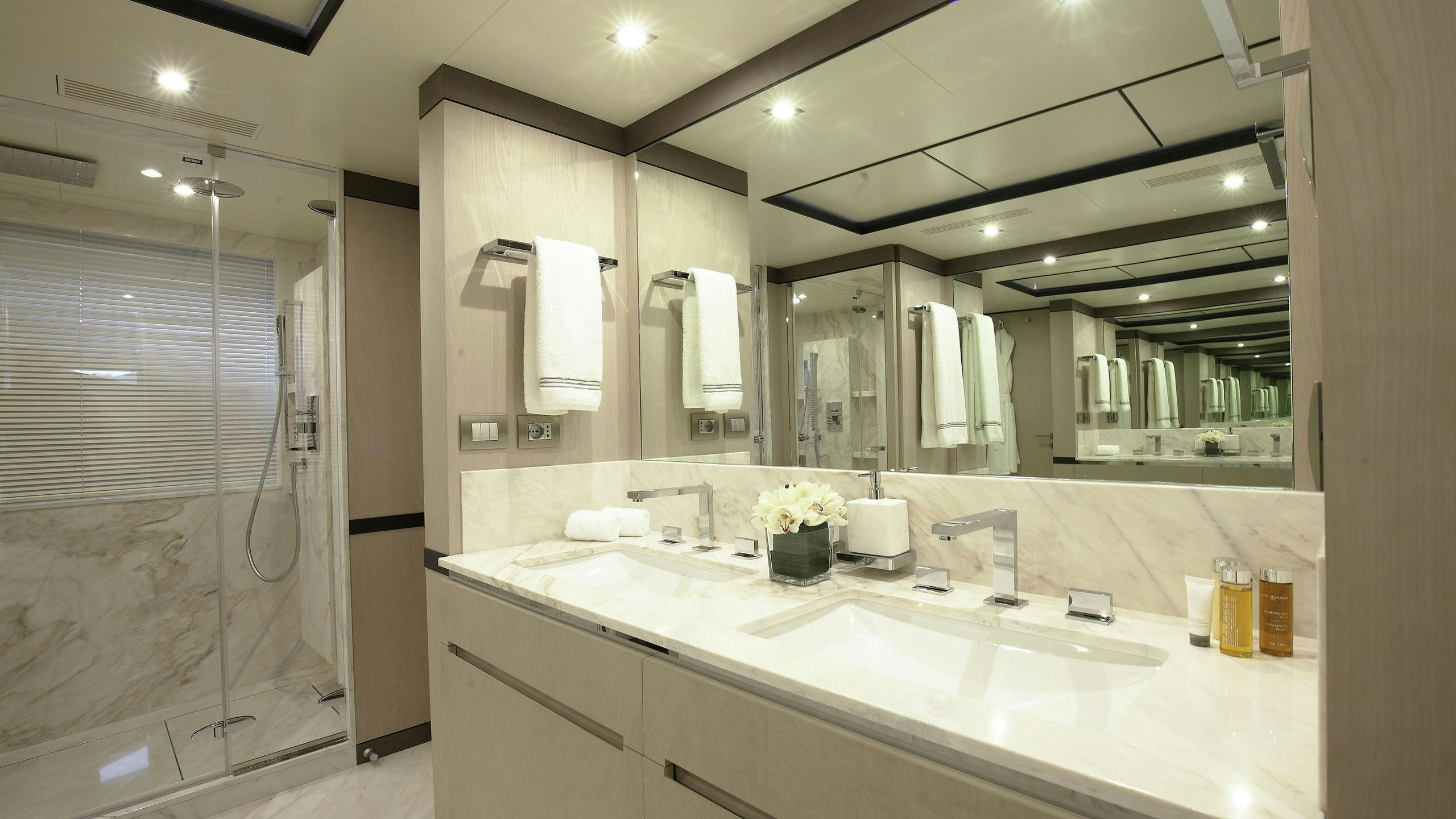 a bathroom with a large mirror aboard WILLOW Yacht for Charter