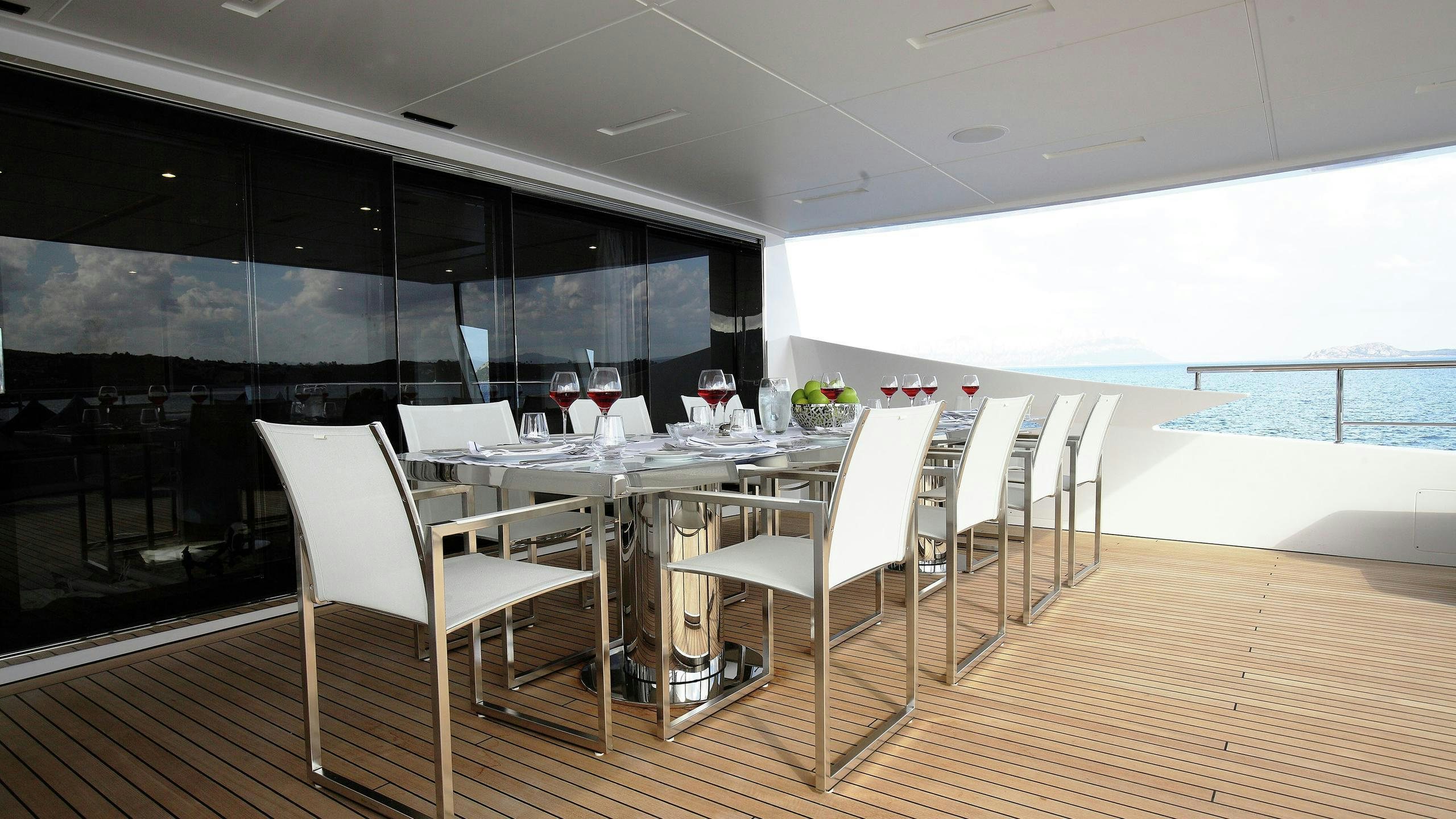a room with tables and chairs aboard WILLOW Yacht for Charter