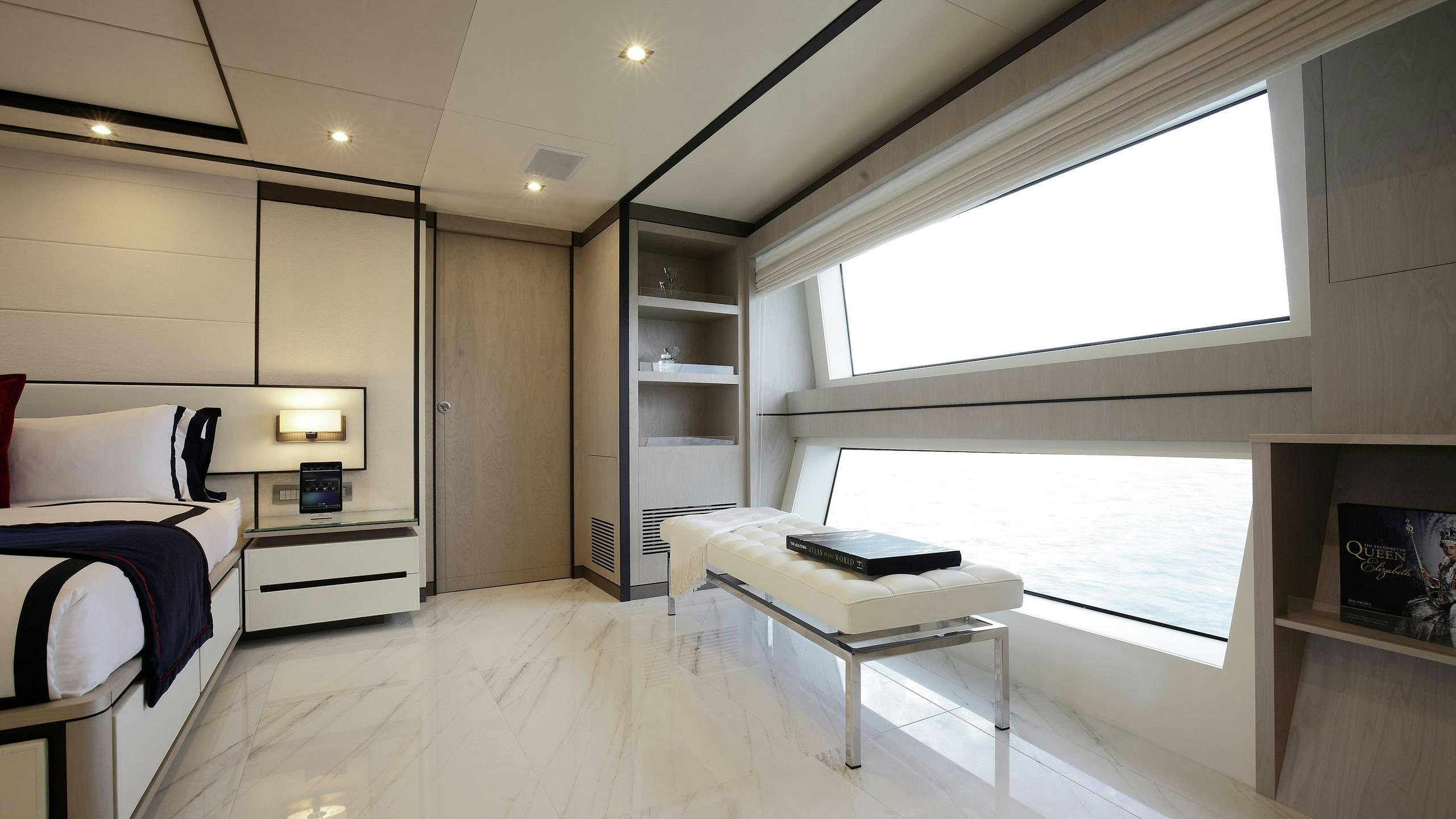 a room with a bed and a desk aboard WILLOW Yacht for Charter