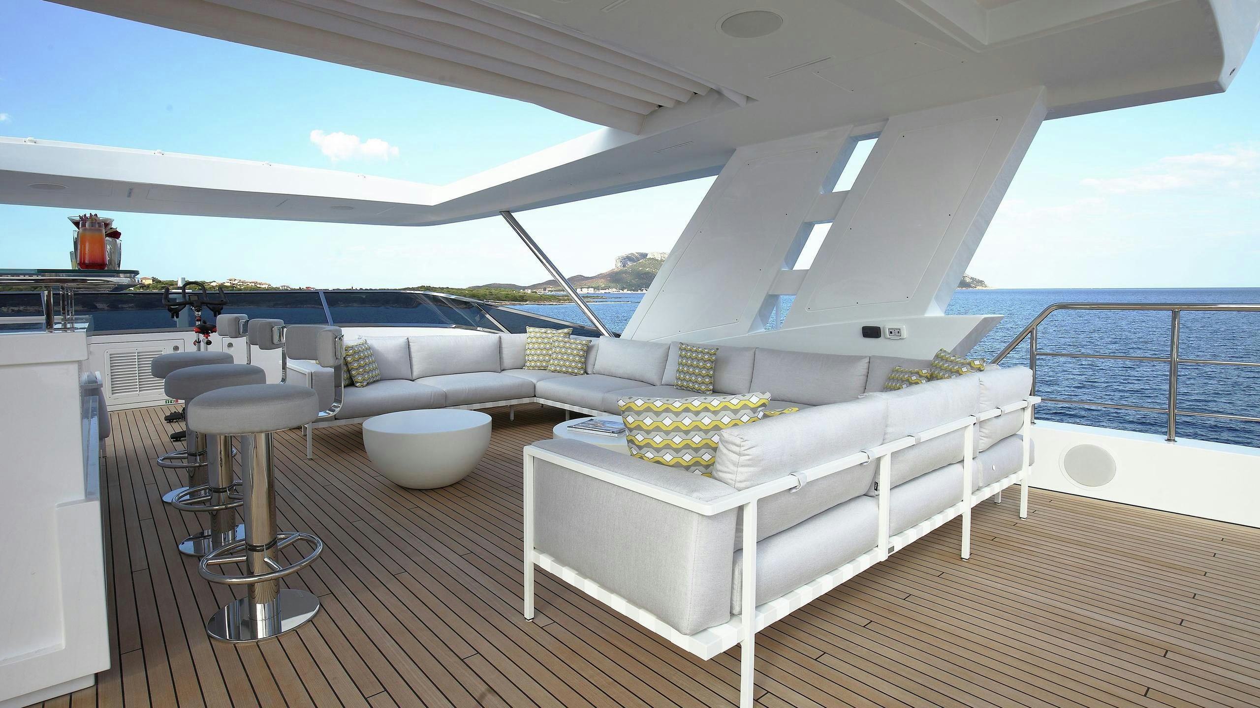 a white couch on a deck aboard WILLOW Yacht for Charter