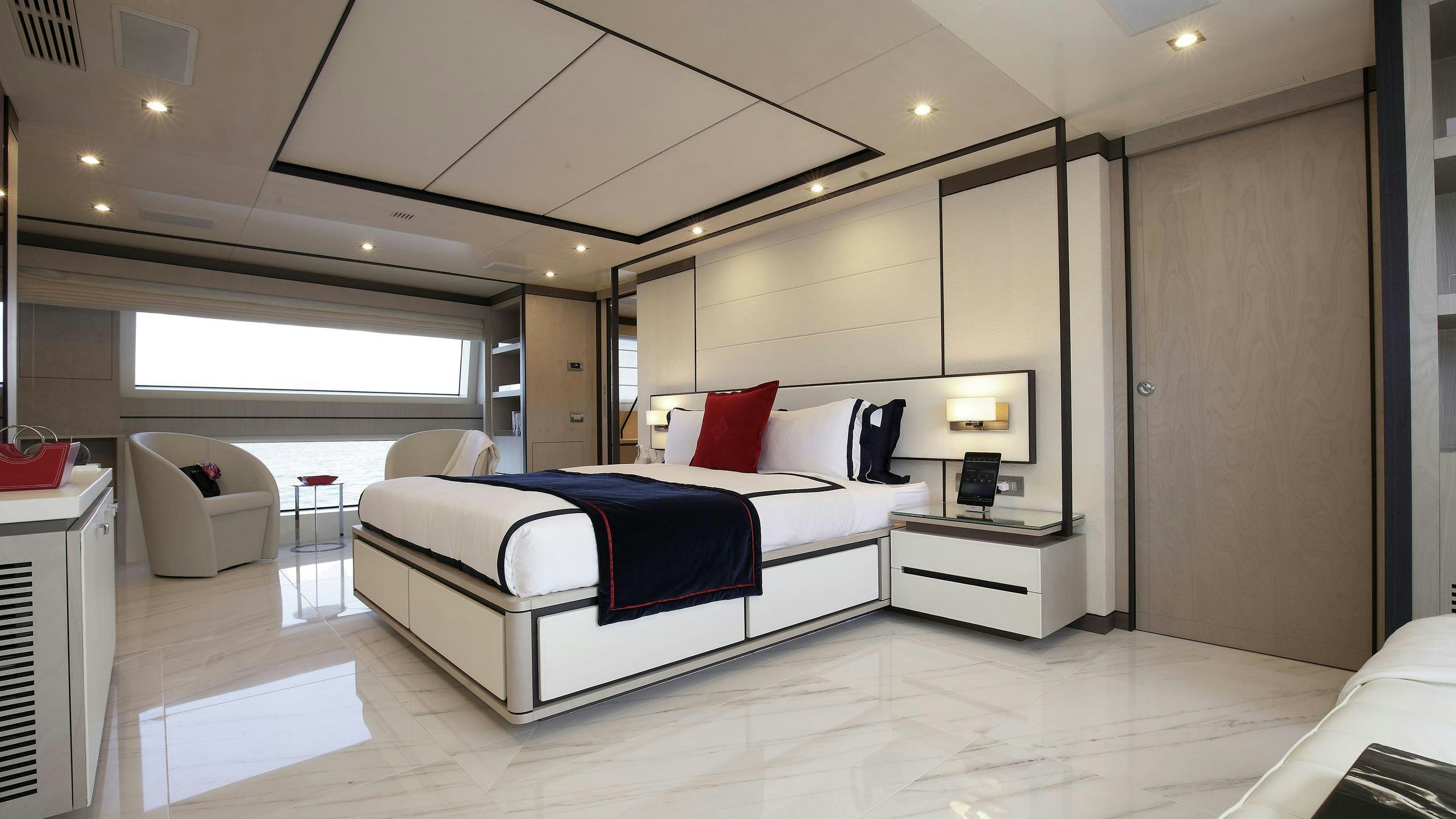 a room with a bed and a couch aboard WILLOW Yacht for Charter