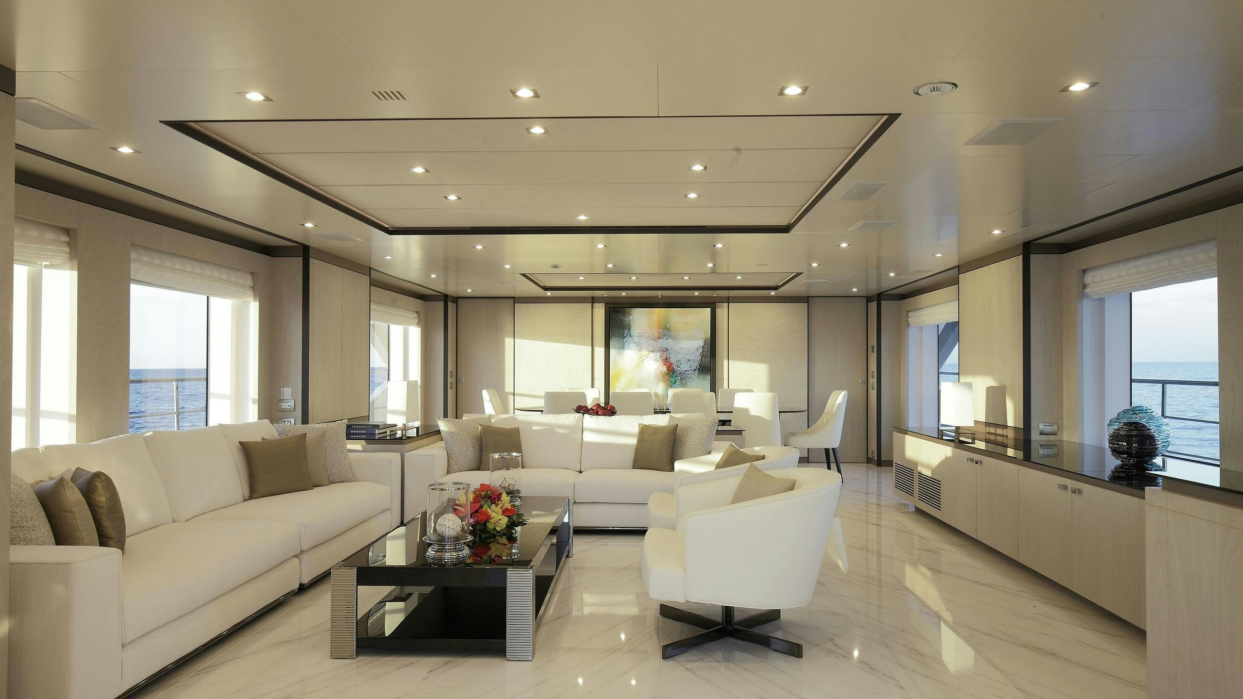 a living room with white furniture aboard WILLOW Yacht for Charter