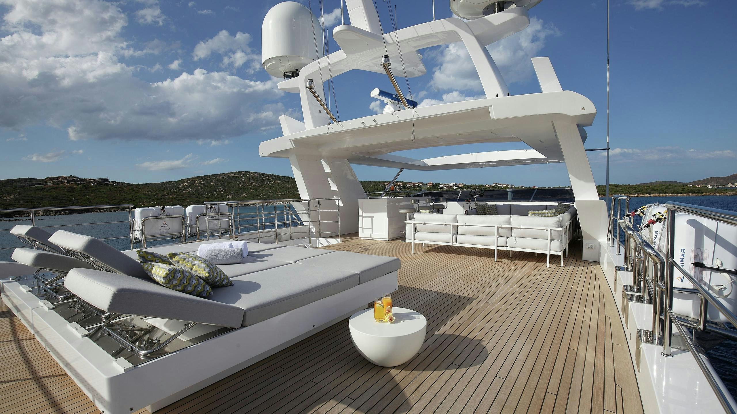 a large white yacht on a dock aboard WILLOW Yacht for Charter