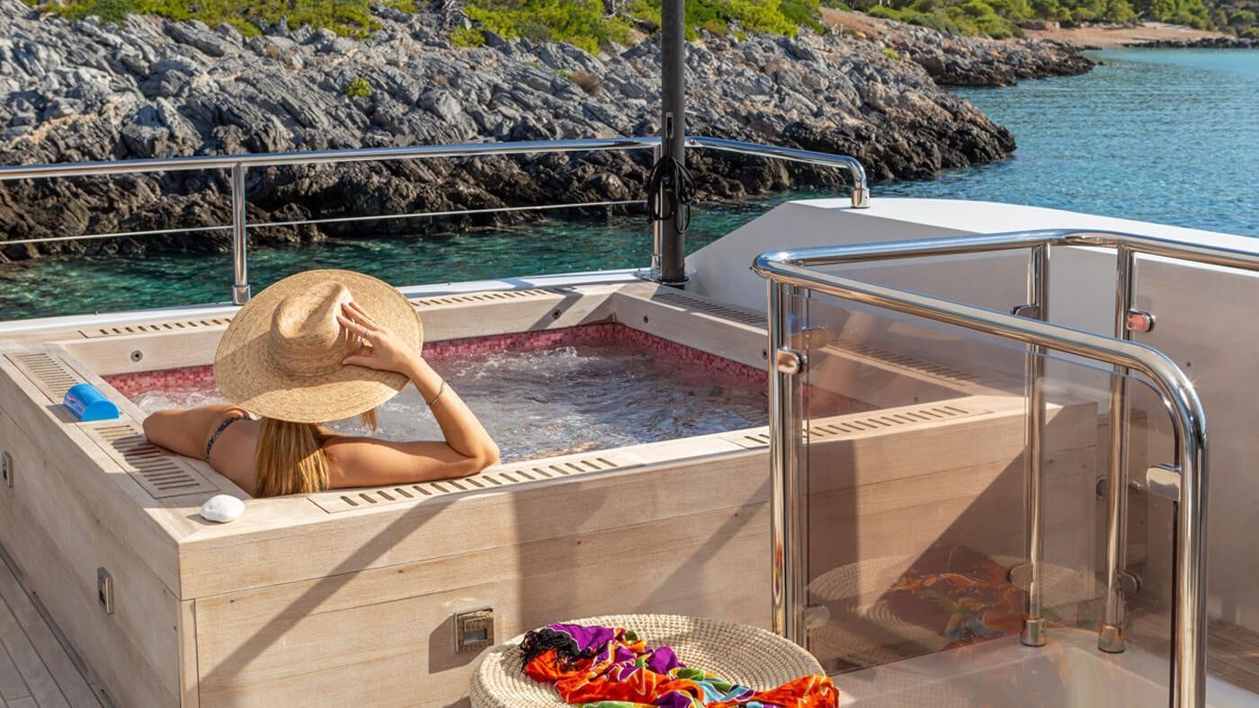 a person sitting on a boat aboard SEA WOLF Yacht for Charter