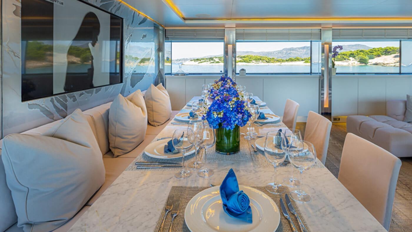 a table set for a dinner aboard SEA WOLF Yacht for Charter