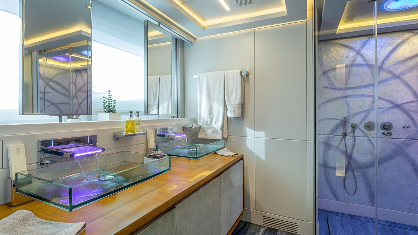 a bathroom with a countertop sink and a large mirror aboard SEA WOLF Yacht for Charter
