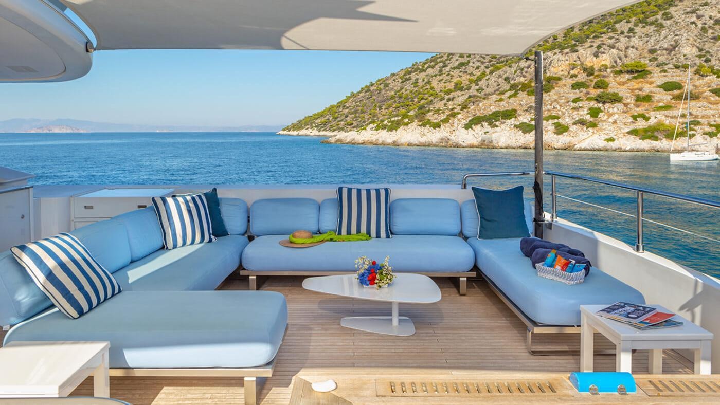 a room with a couch and a table and a pool aboard SEA WOLF Yacht for Charter
