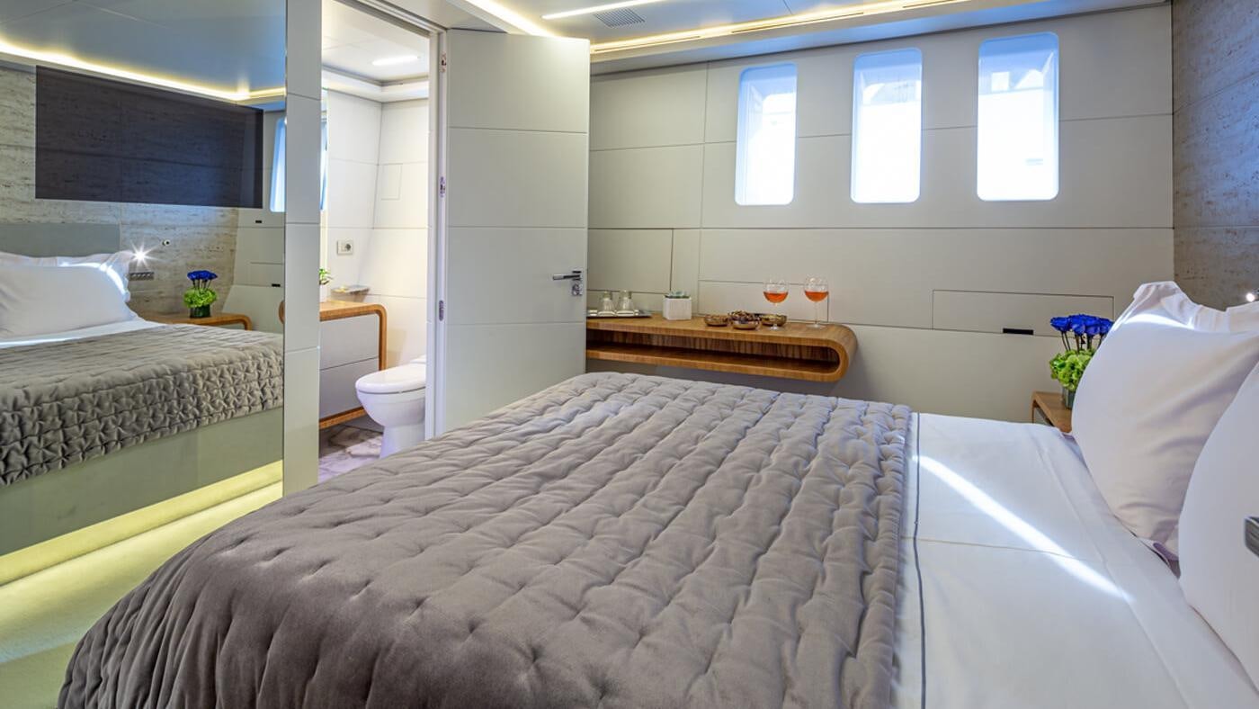 a bedroom with a large bed aboard SEA WOLF Yacht for Charter