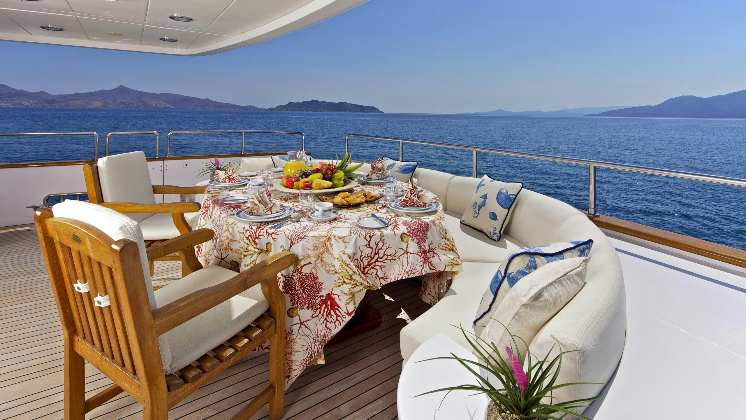 a table with food on it aboard O'RION Yacht for Charter