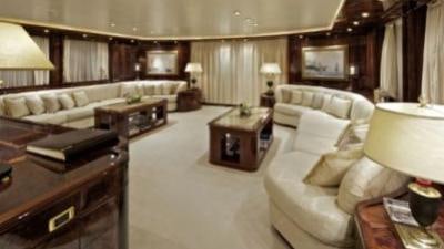 a living room with a large bed aboard O'RION Yacht for Charter