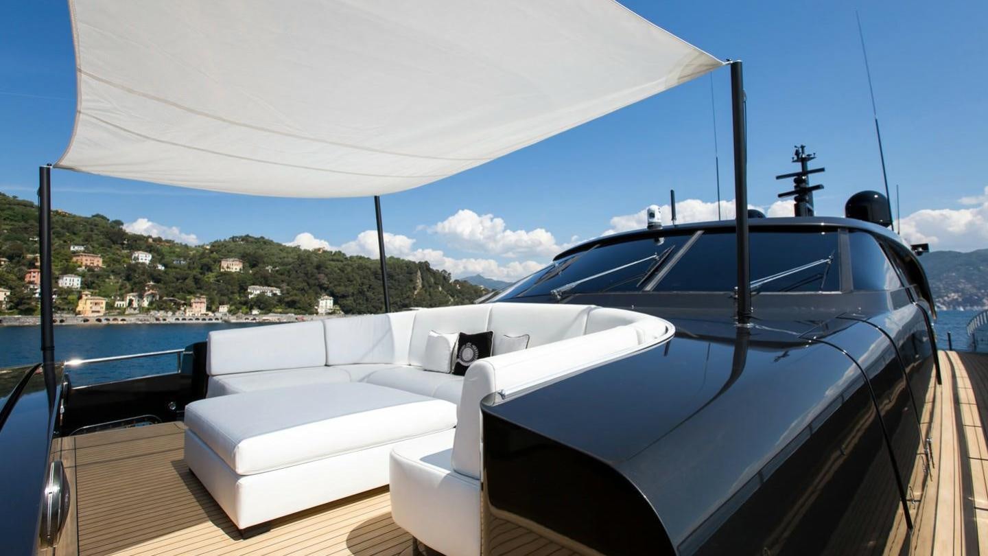 a white boat on a deck aboard AQUILA Yacht for Charter