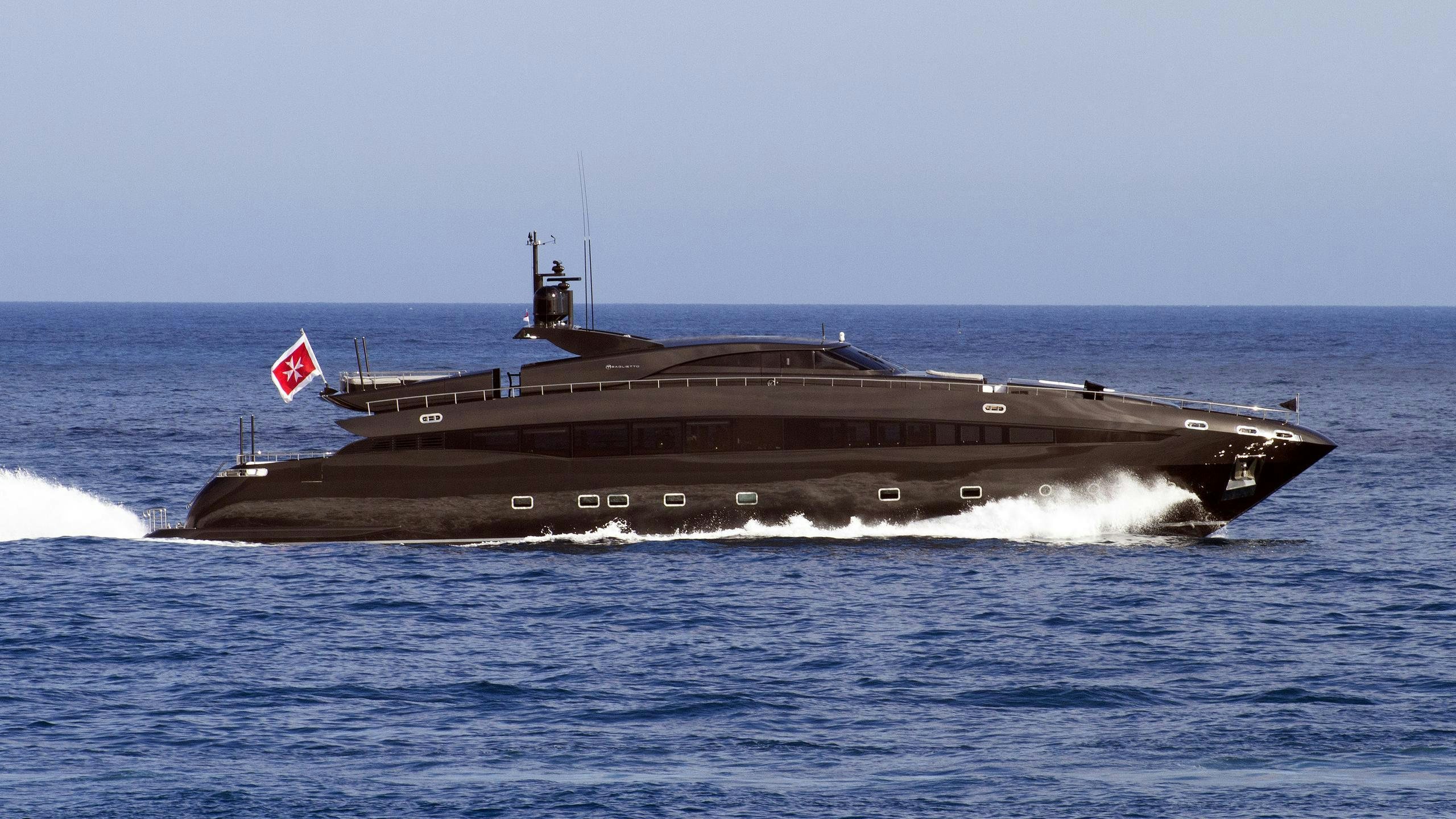a large ship in the water aboard AQUILA Yacht for Charter