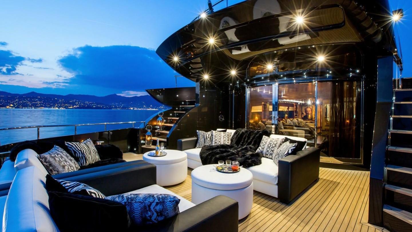 a living room with a large balcony aboard AQUILA Yacht for Charter