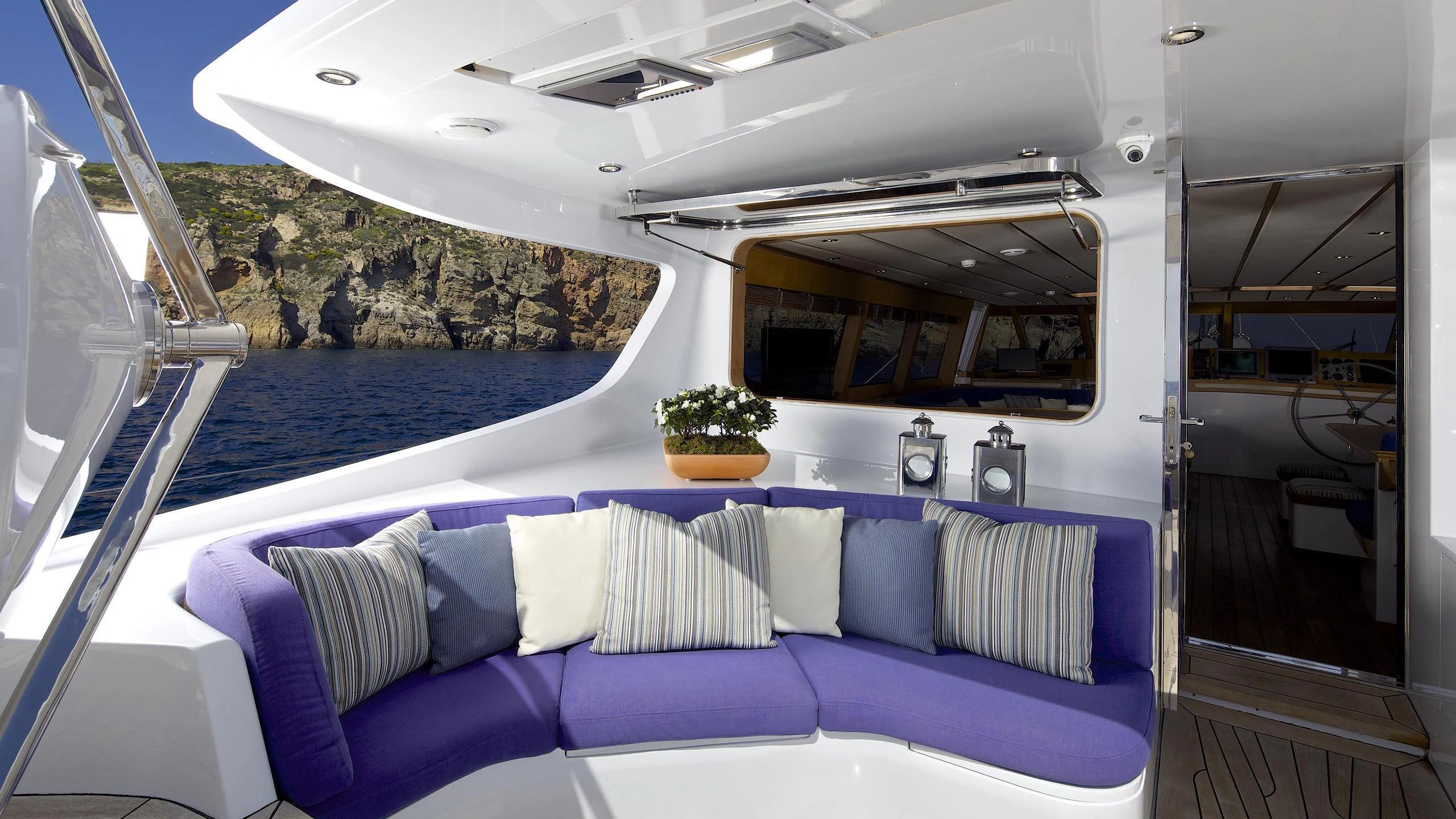 a boat with a blue seat aboard ALLURE A Yacht for Charter