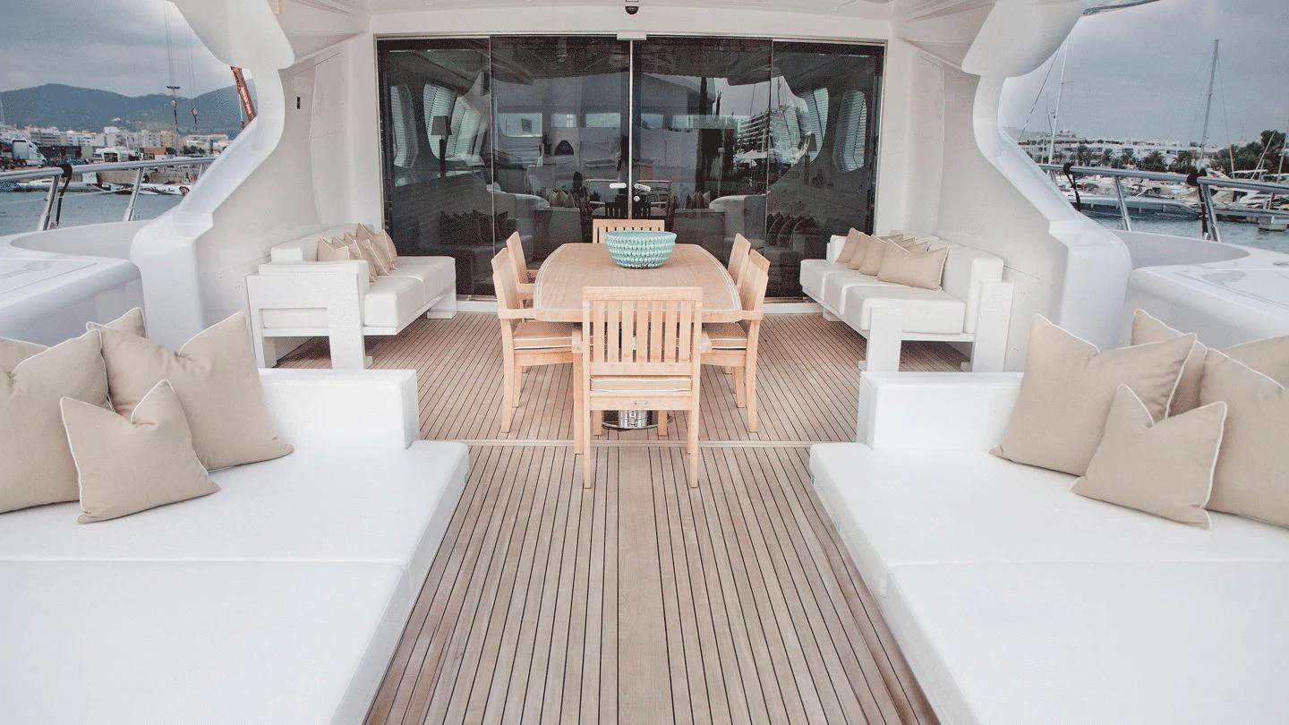 a room with a couch and a table and chairs aboard ALLURE A Yacht for Charter