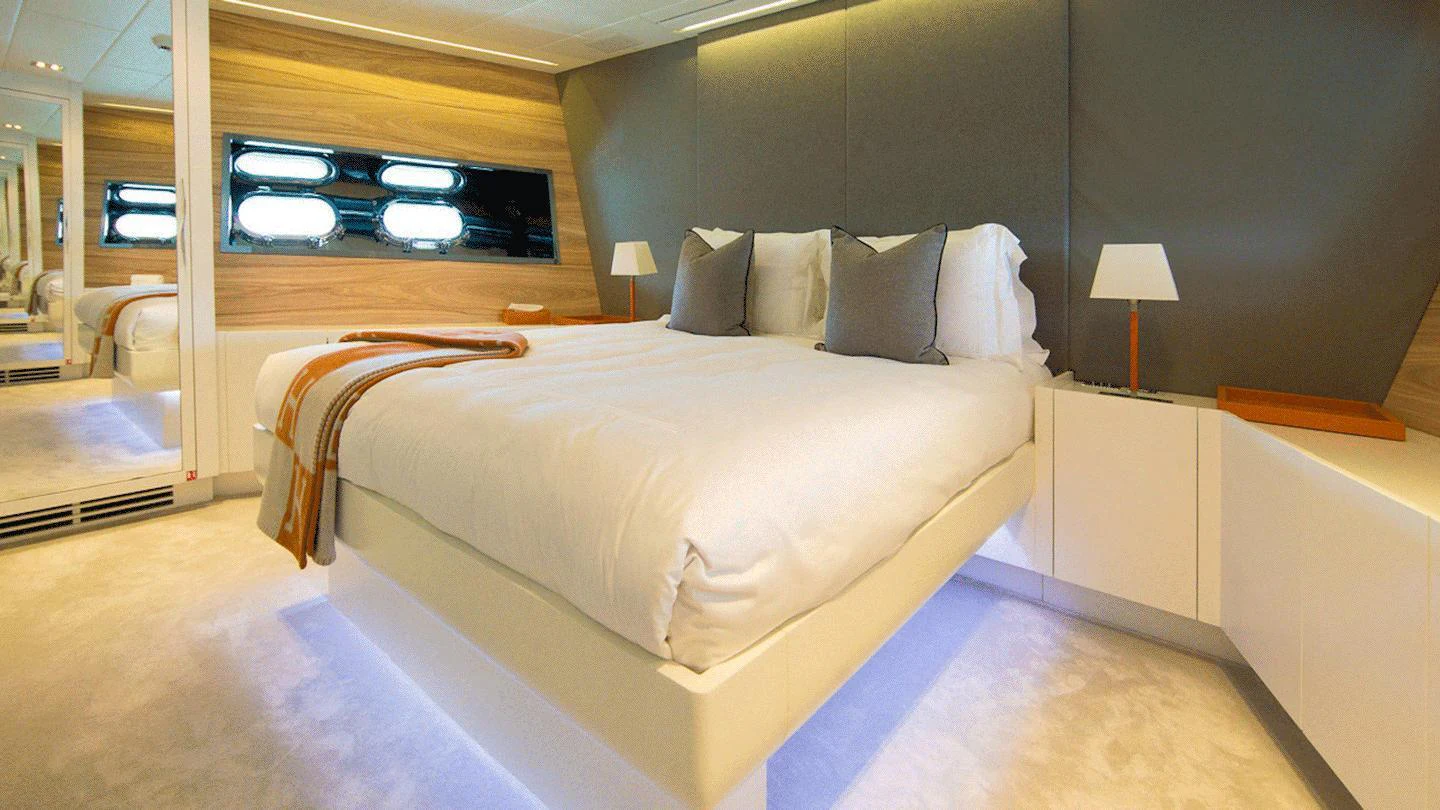 a bed in a room aboard ALLURE A Yacht for Charter