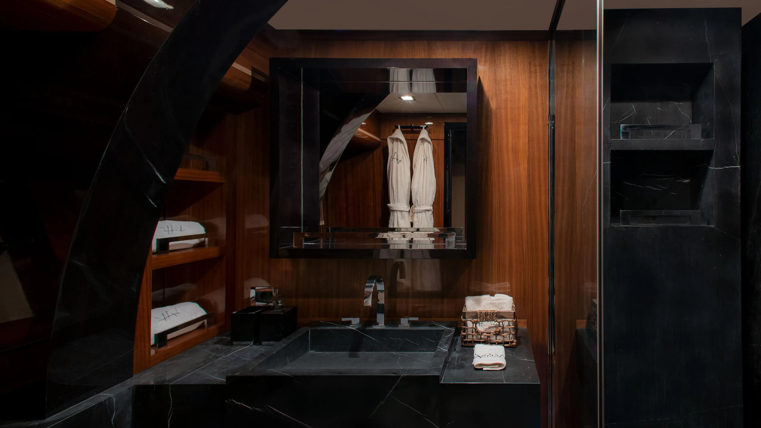a bathroom with a large mirror aboard VAY Yacht for Charter