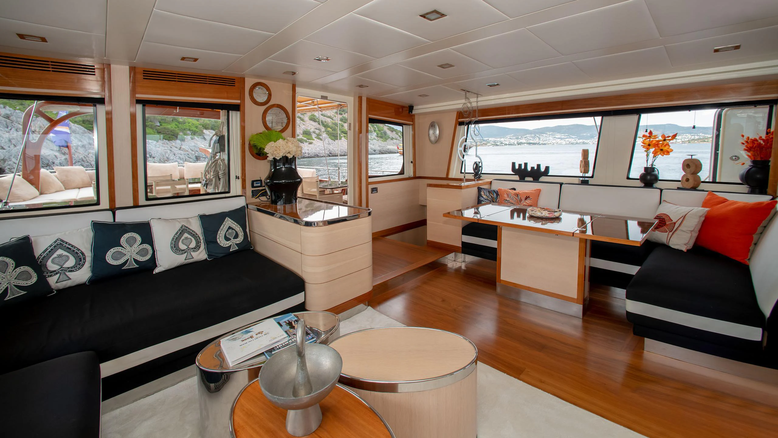 a living room with a black couch and a black couch aboard VAY Yacht for Charter