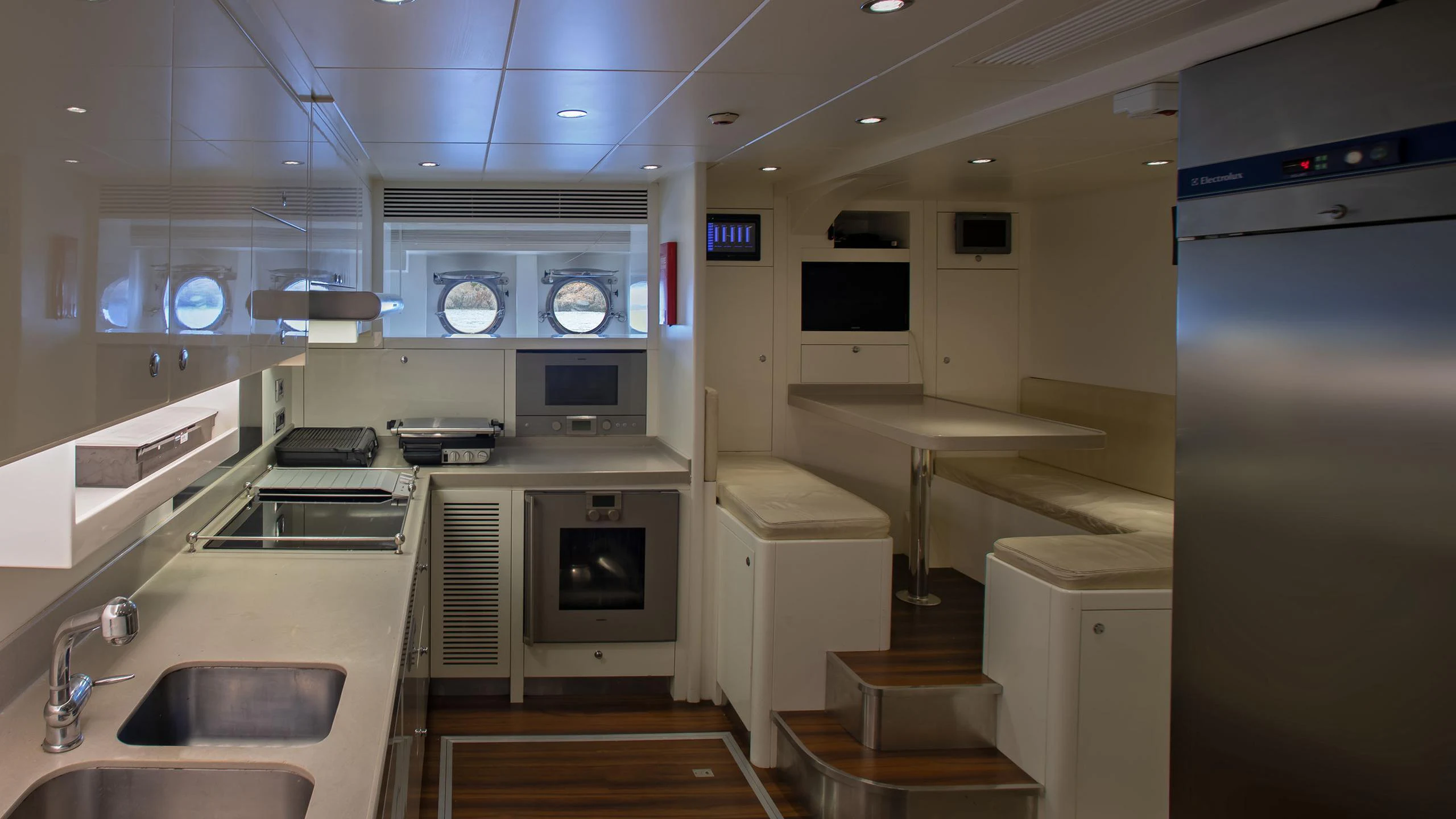 a kitchen with a sink and a microwave oven aboard VAY Yacht for Charter