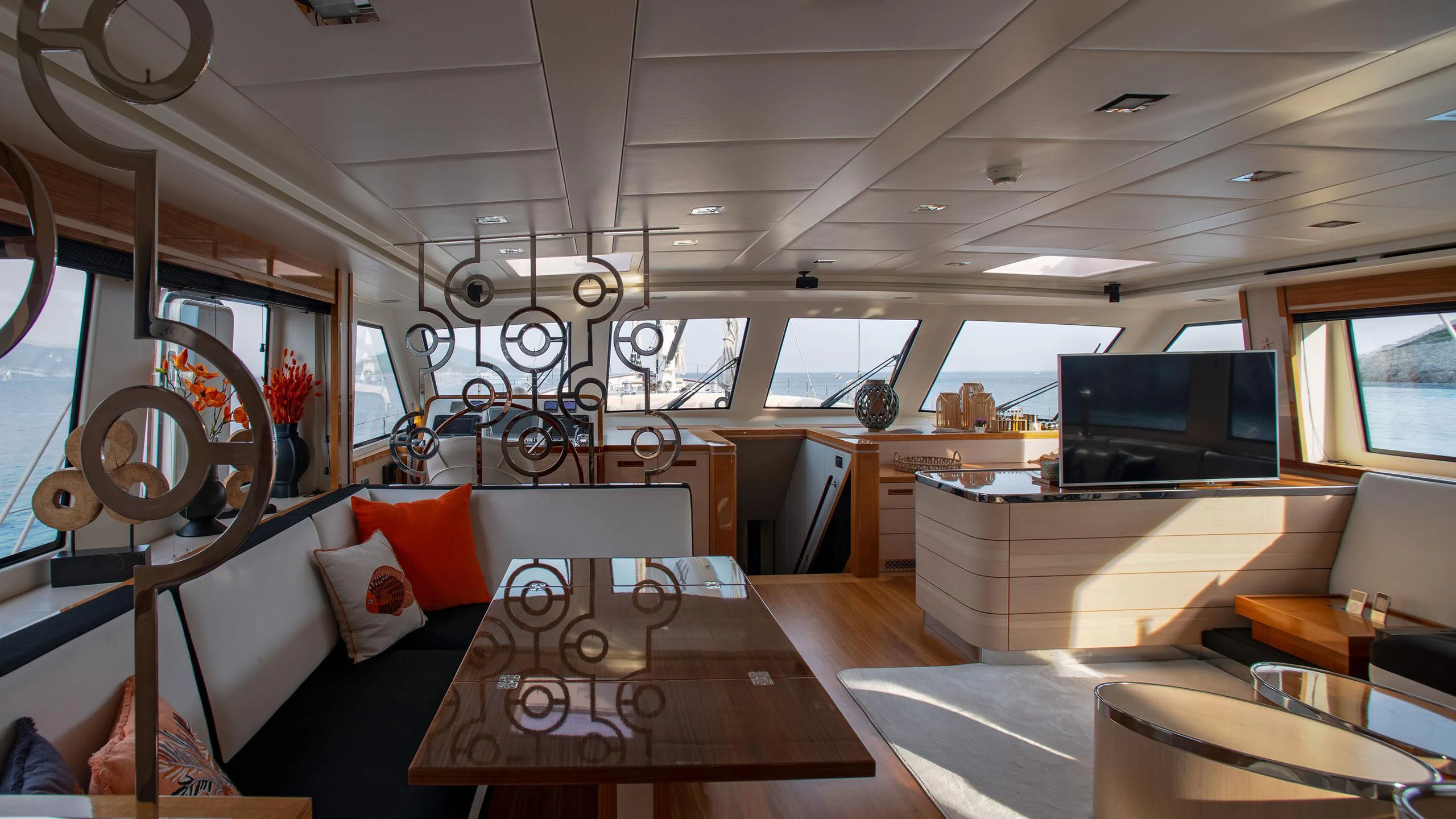 inside of a building with a table and chairs aboard VAY Yacht for Charter