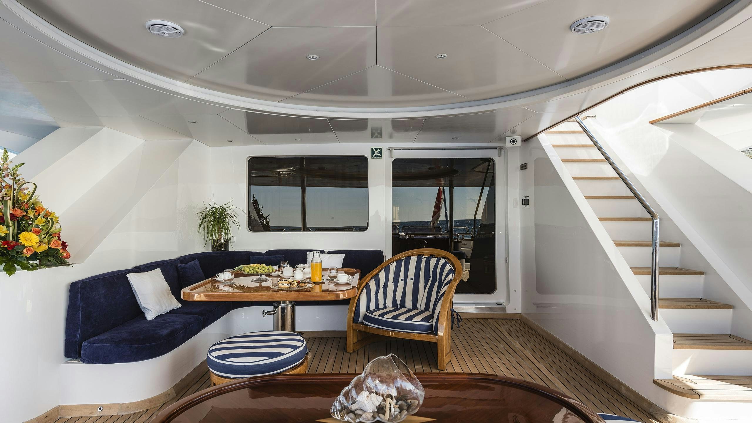 a modern looking living room aboard DESAMIS B Yacht for Charter
