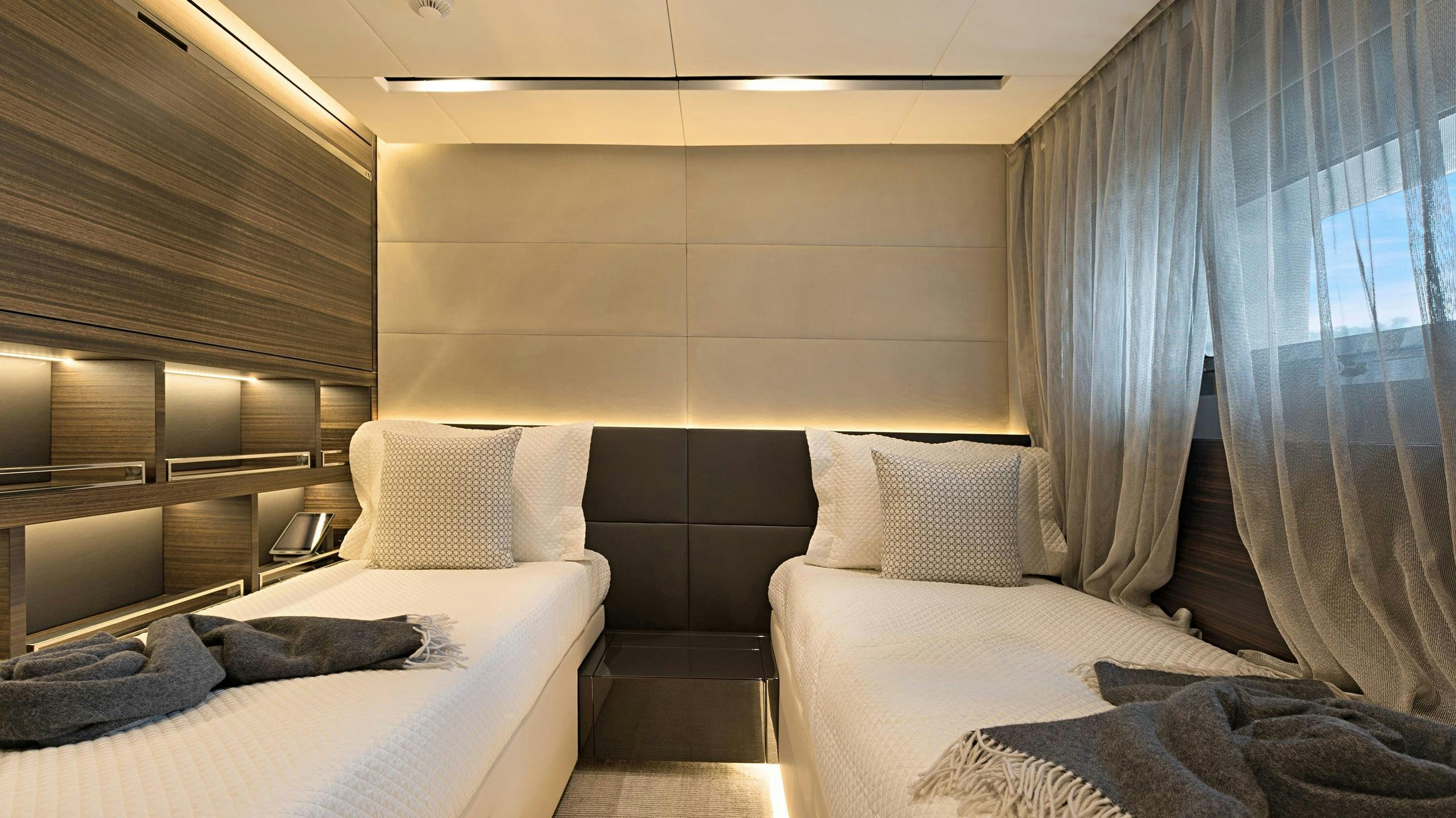 a room with a bed and a window aboard SAFE HAVEN Yacht for Charter