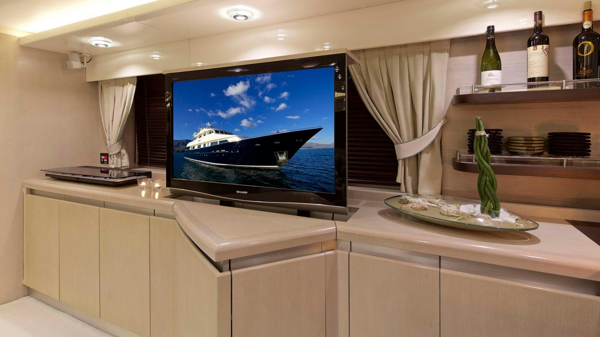a tv on a counter aboard MAGIX Yacht for Charter