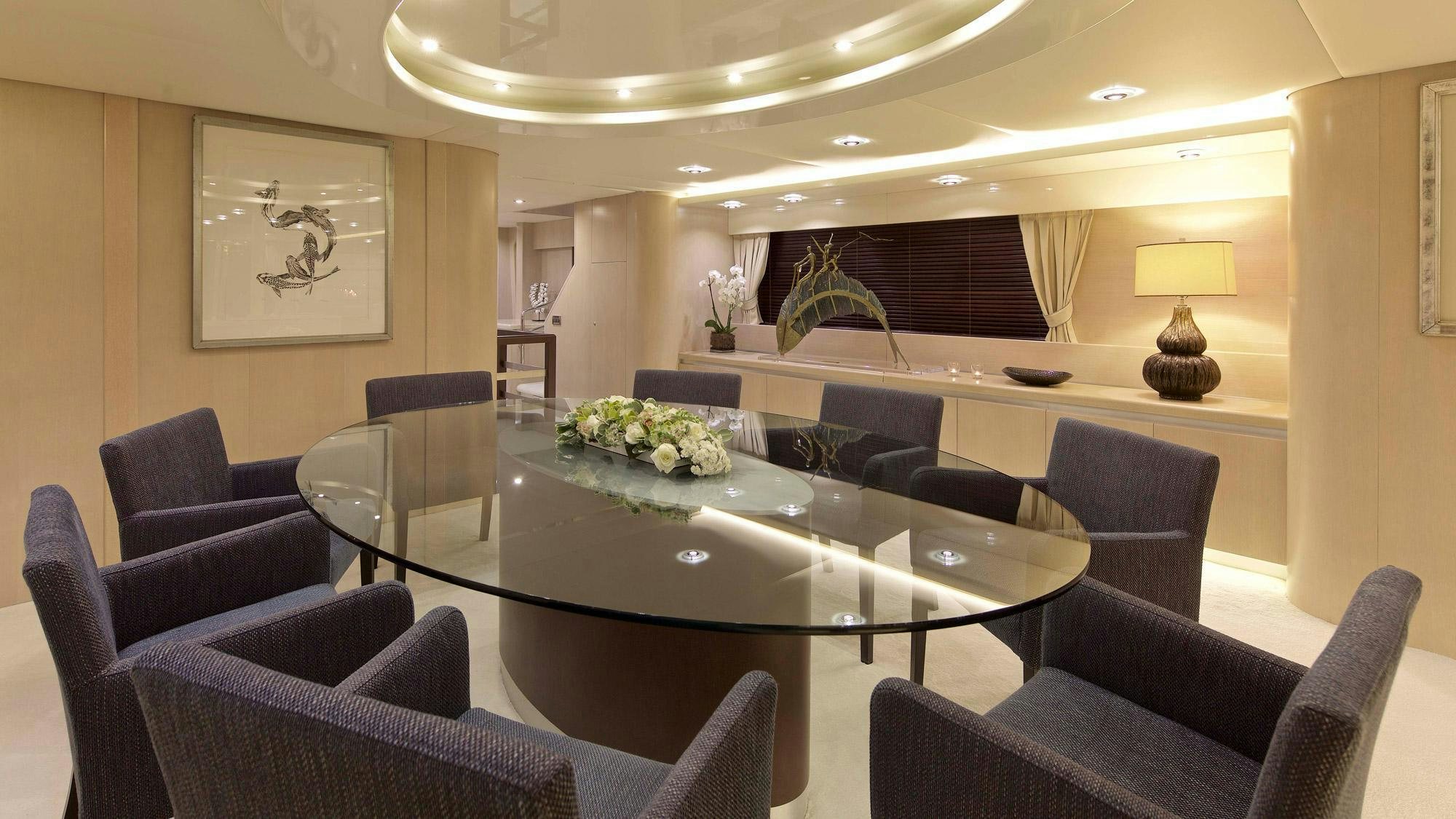 a room with a table chairs and a couch aboard MAGIX Yacht for Charter