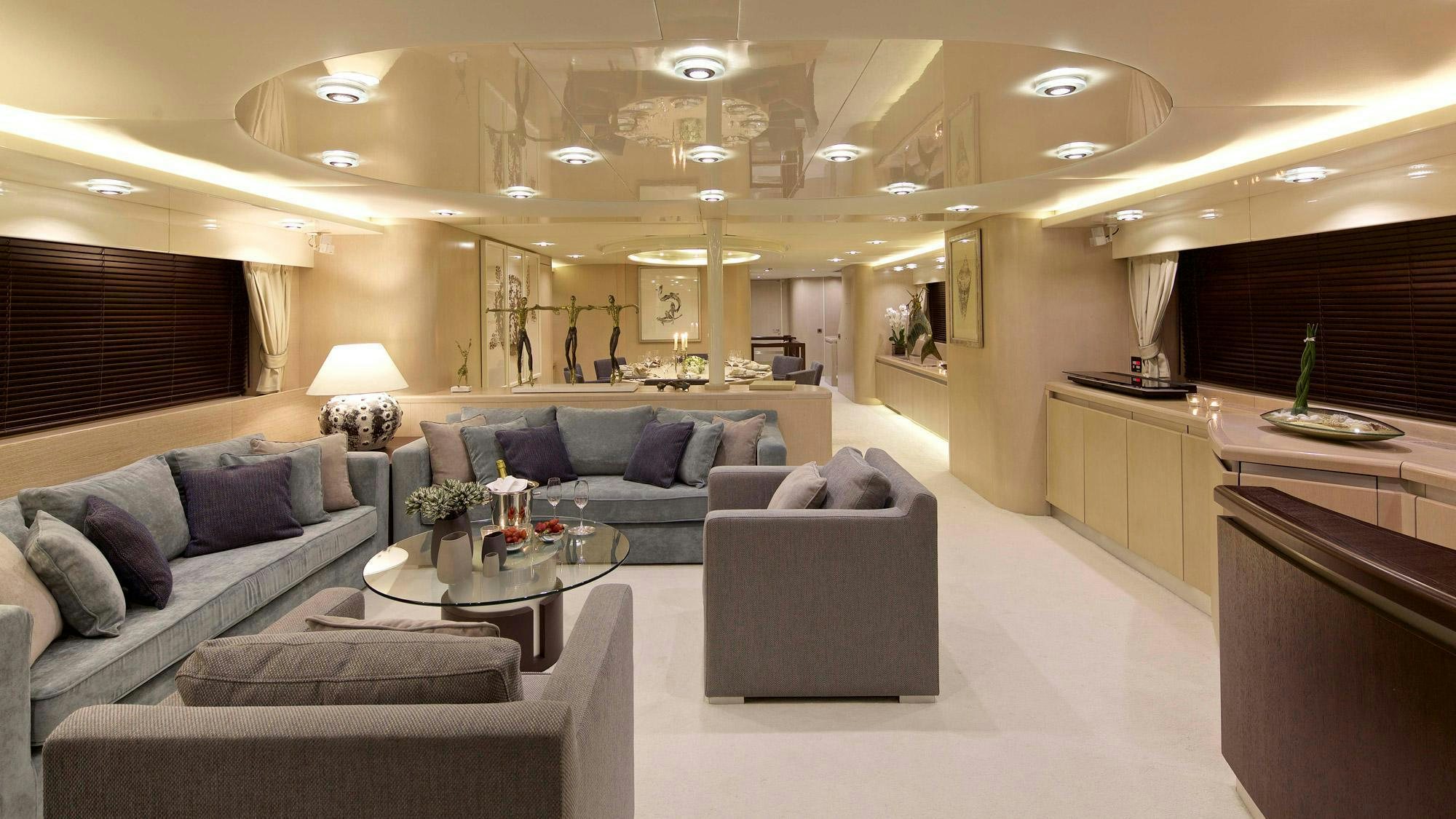 a living room with a couch and a coffee table aboard MAGIX Yacht for Charter