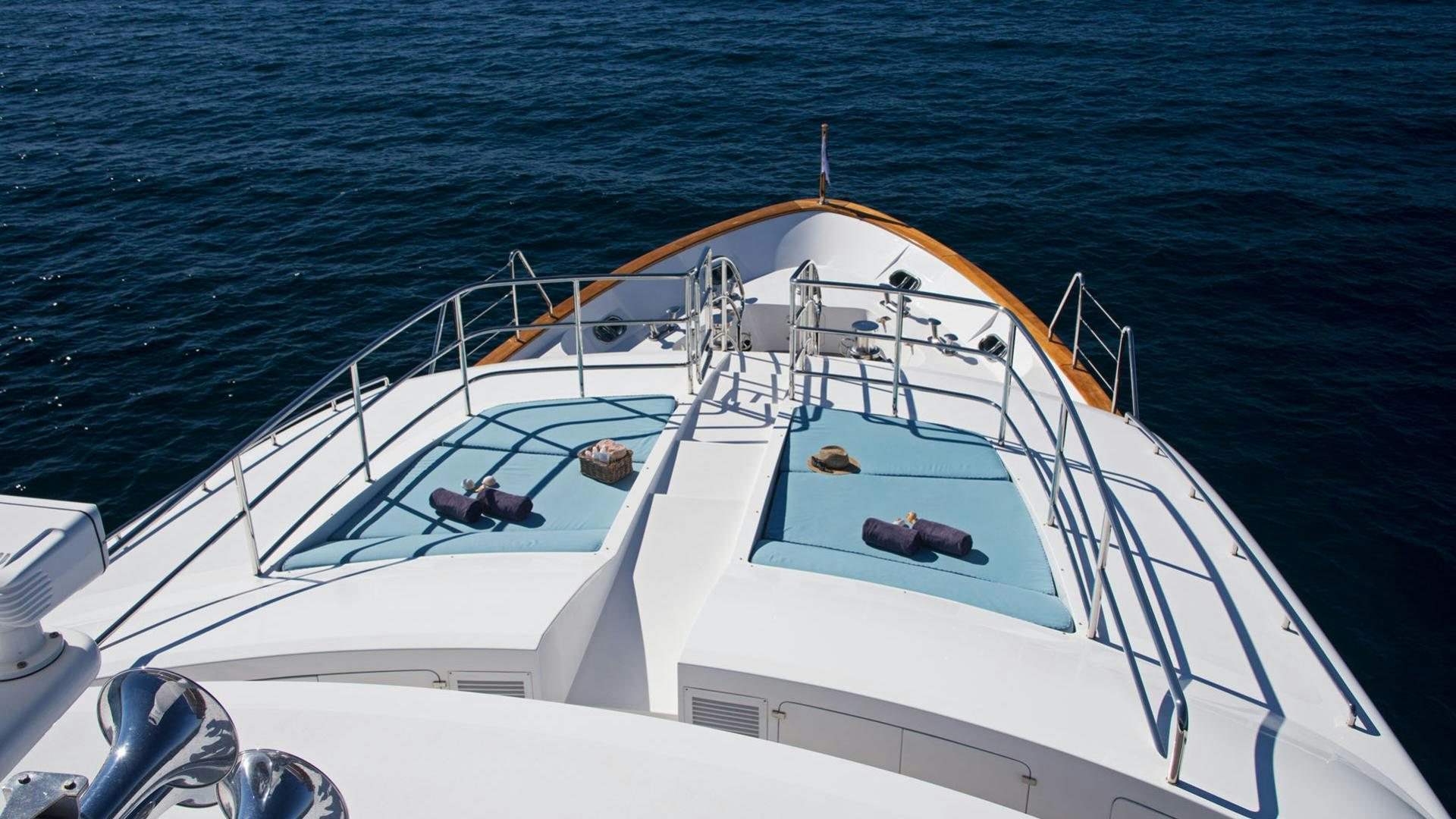 a white boat in the water aboard OPTION B Yacht for Charter