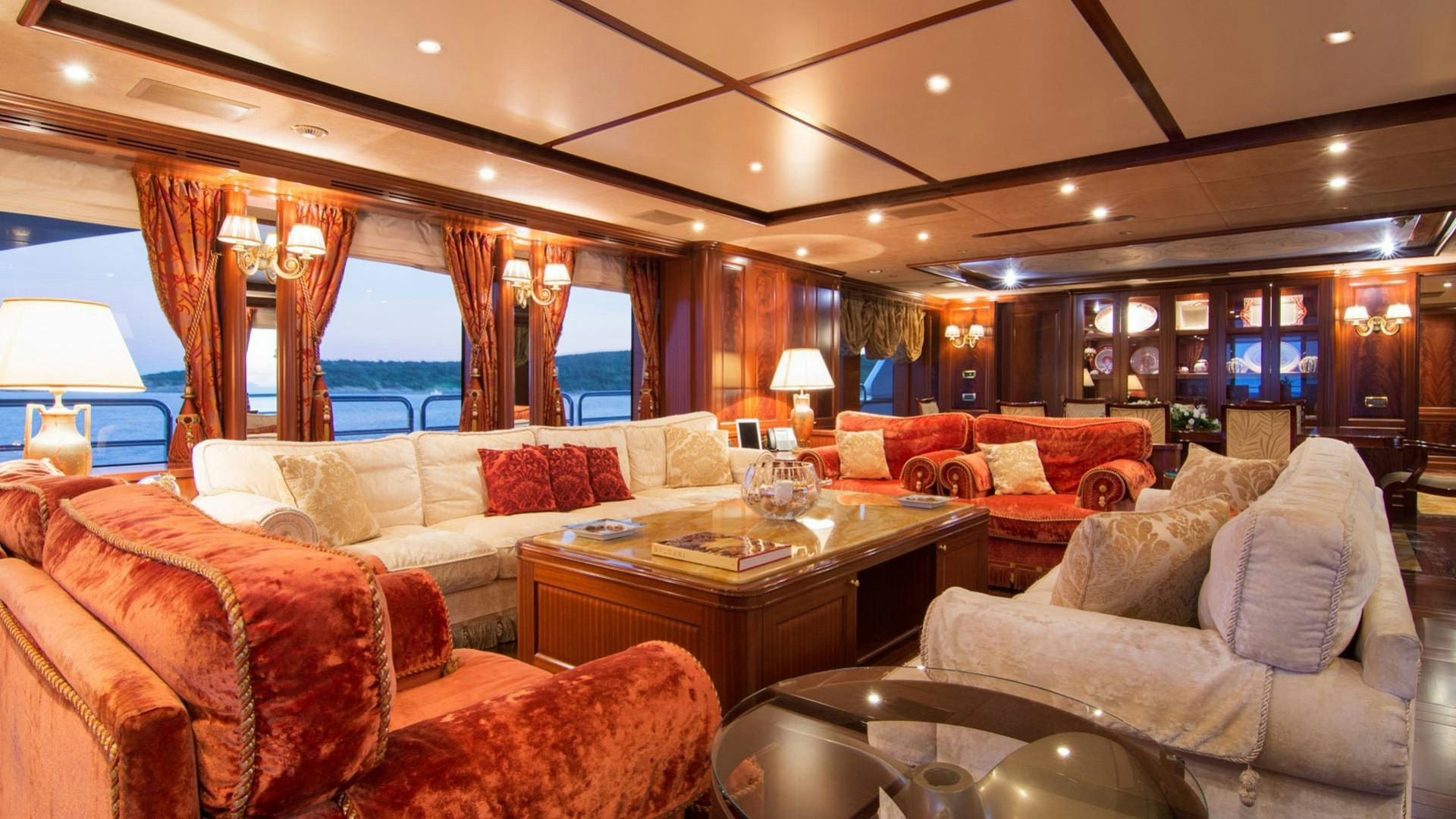 a living room with a large window aboard OPTION B Yacht for Charter