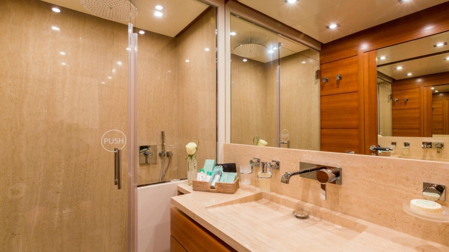 a bathroom with a large mirror aboard ARION Yacht for Charter