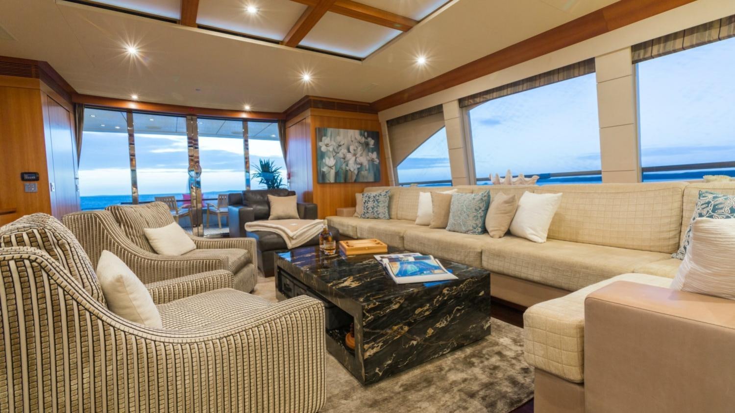 a living room with a large window aboard ARION Yacht for Charter