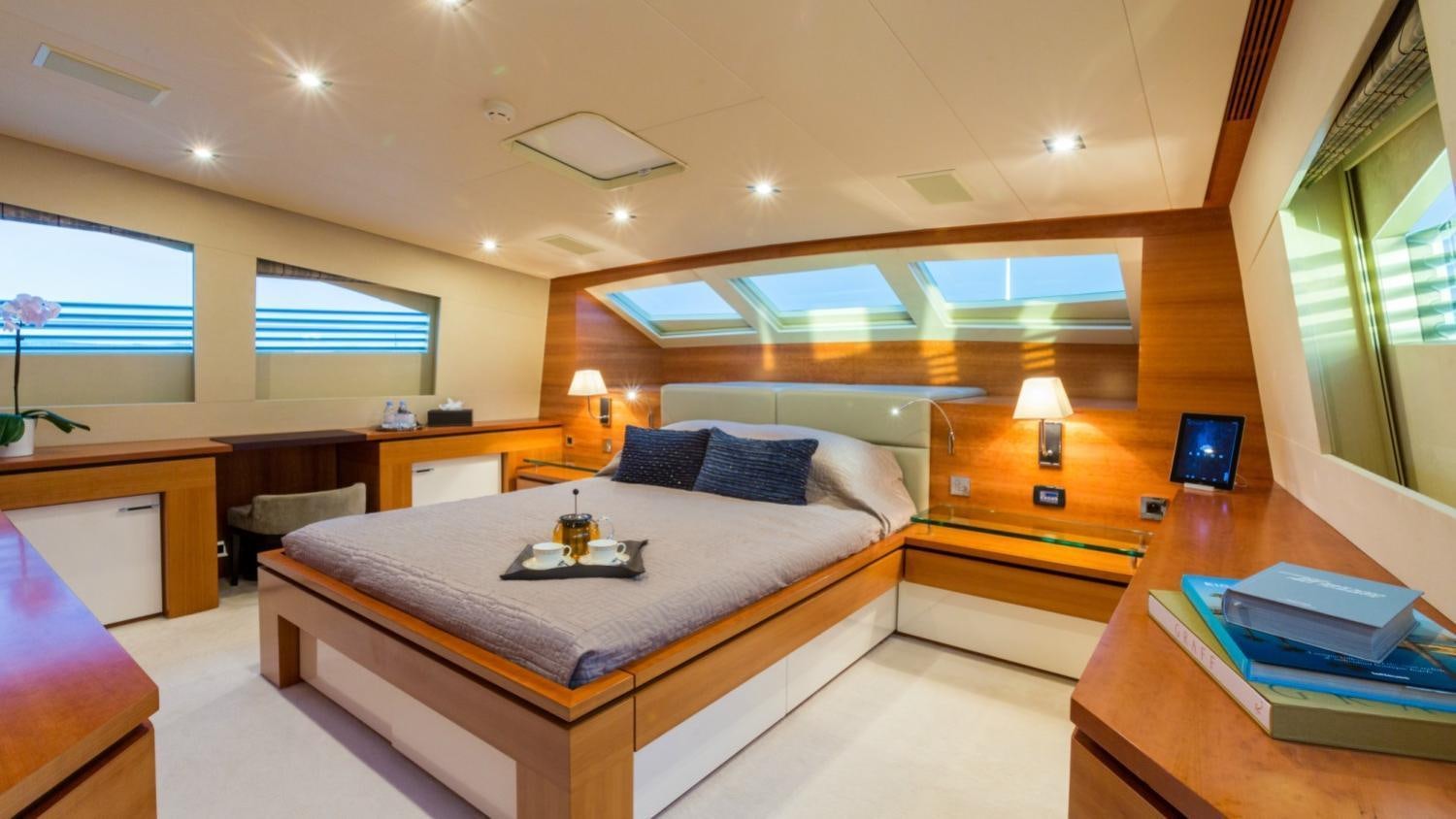 a bedroom with a bed and a desk aboard ARION Yacht for Charter