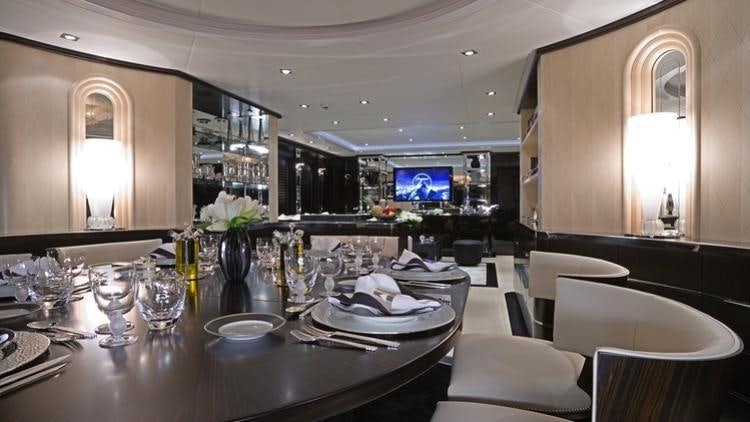 a large kitchen with a large table aboard G-FORCE Yacht for Charter