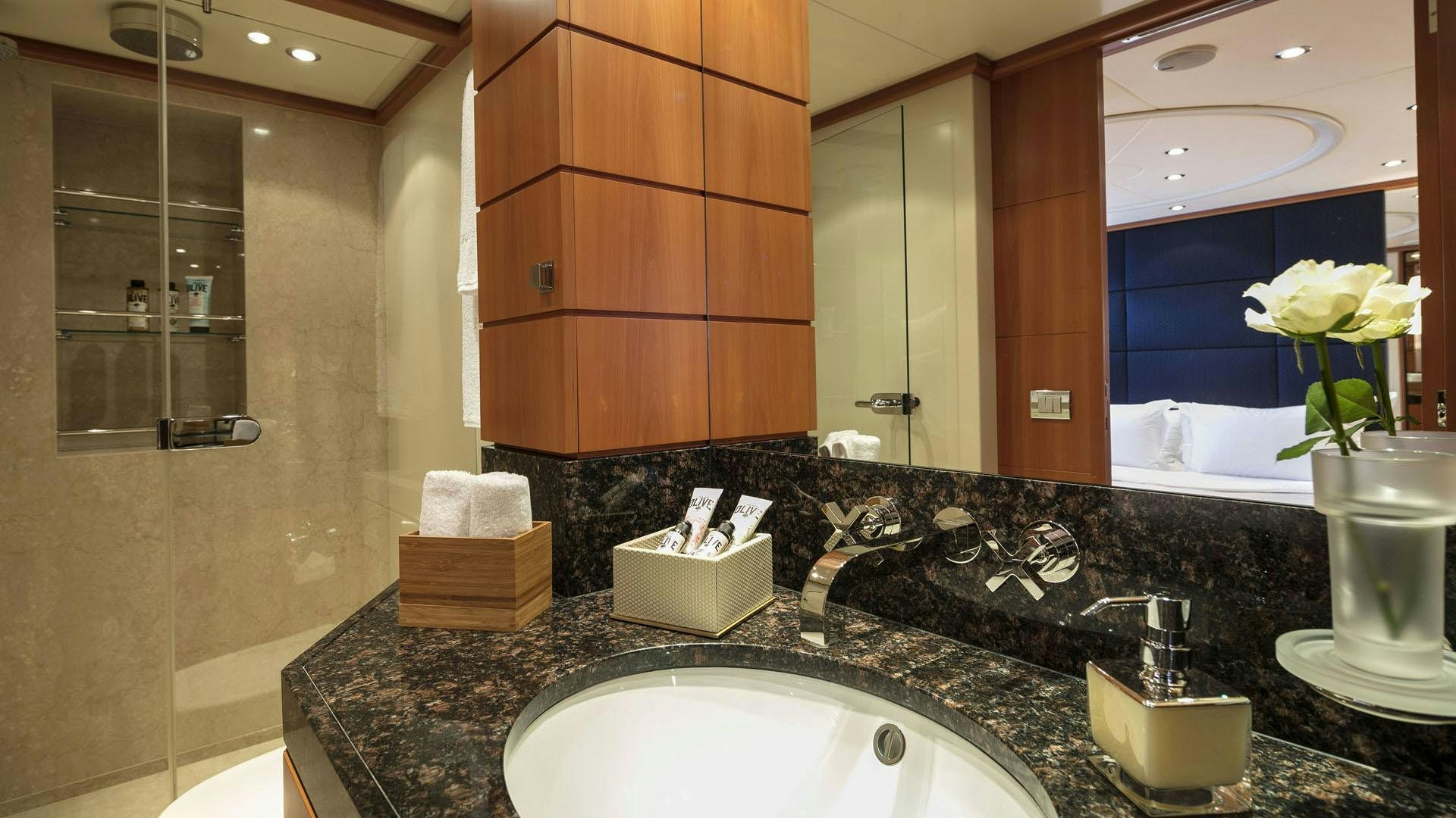 a bathroom with a large mirror aboard L'EQUINOX Yacht for Charter