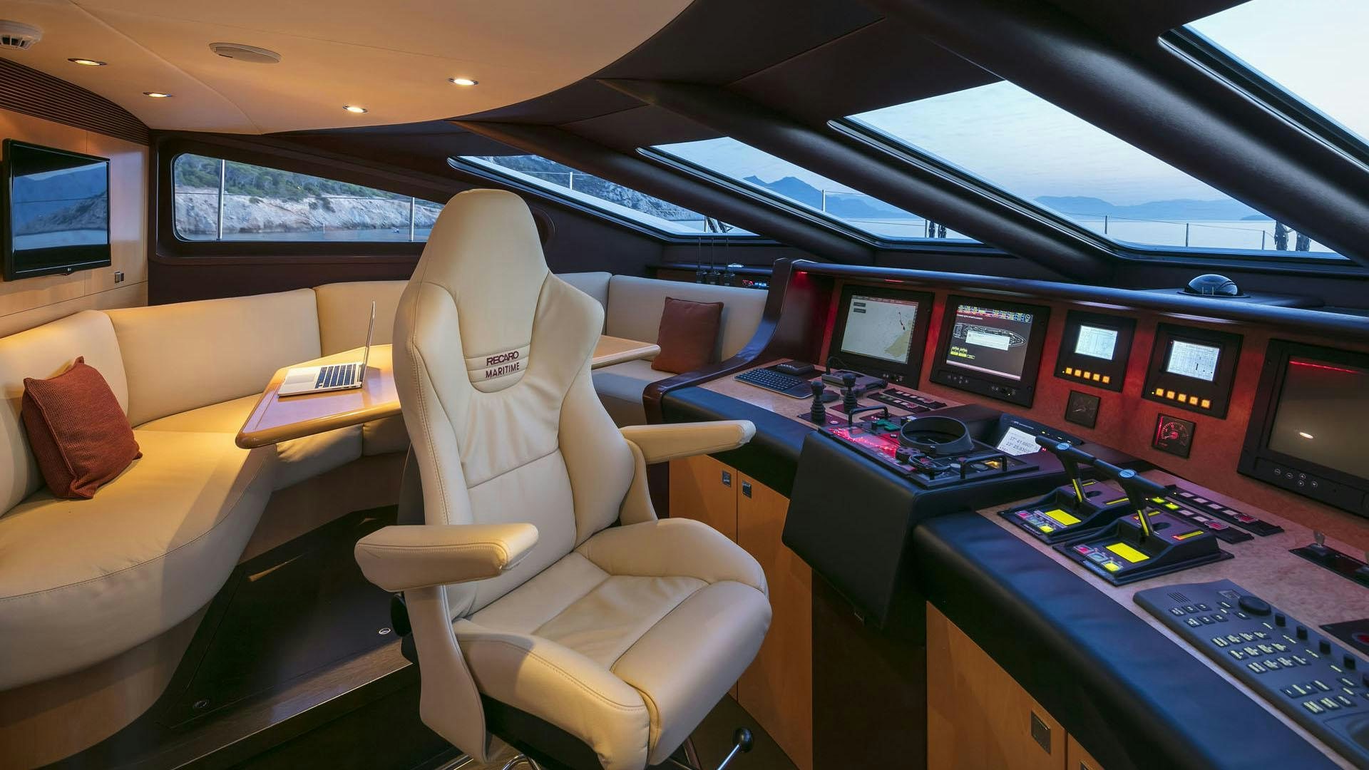 a room with many monitors and computers aboard L'EQUINOX Yacht for Charter