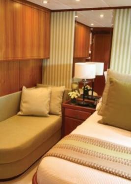 a hotel room with two beds aboard GITANA Yacht for Charter