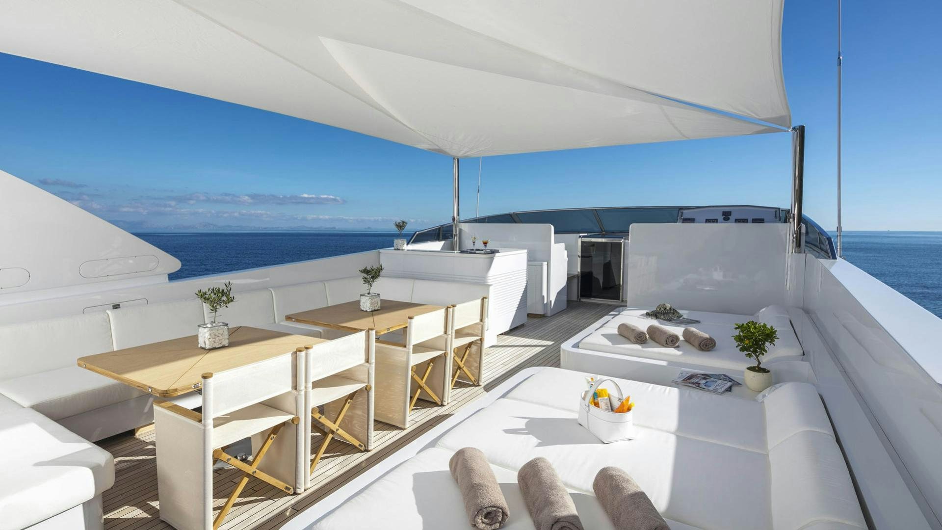 a room with a table and chairs aboard SOLE DI MARE Yacht for Charter