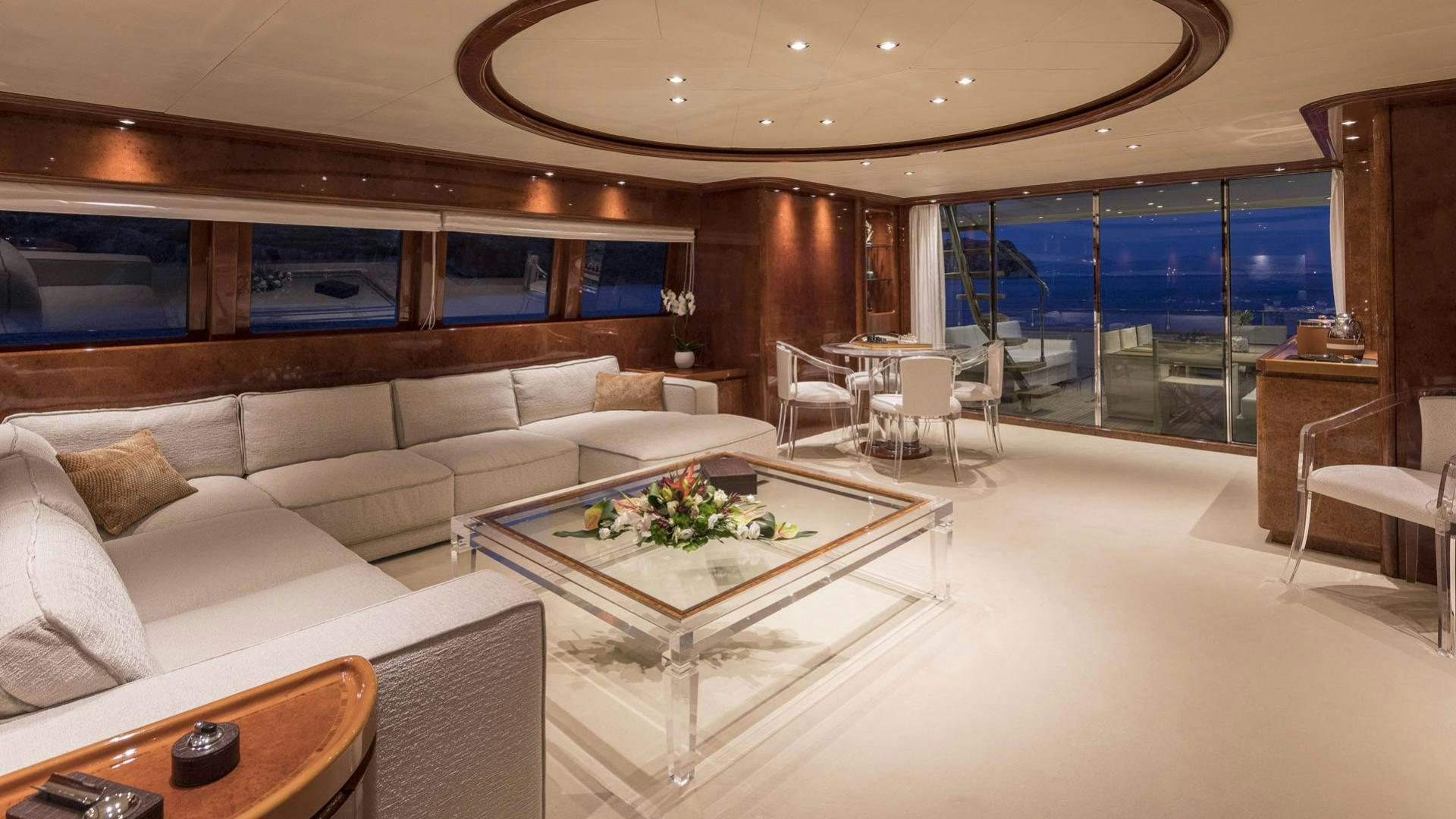 a living room with a large window aboard SOLE DI MARE Yacht for Charter