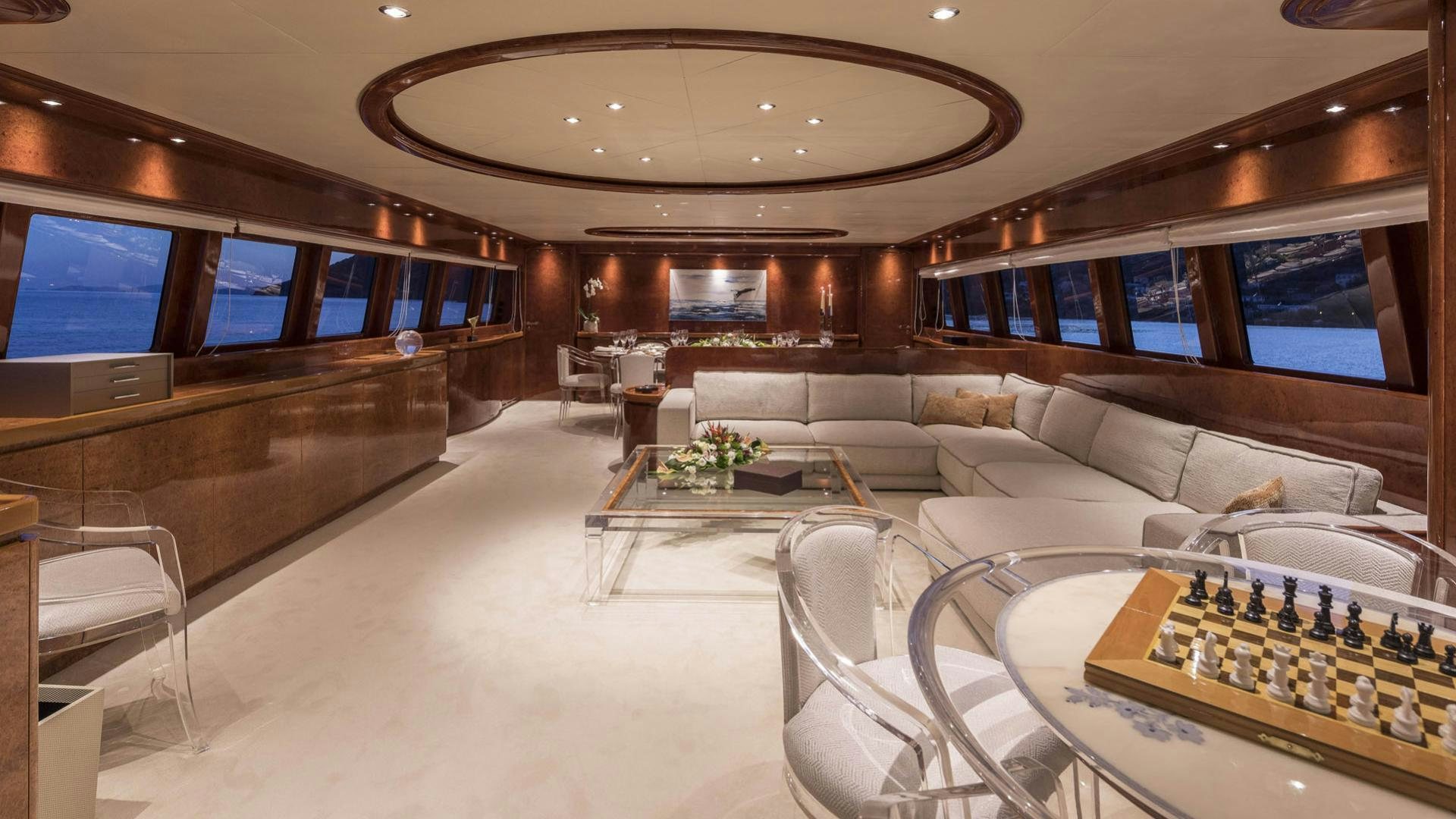 a living room with a large screen aboard SOLE DI MARE Yacht for Charter