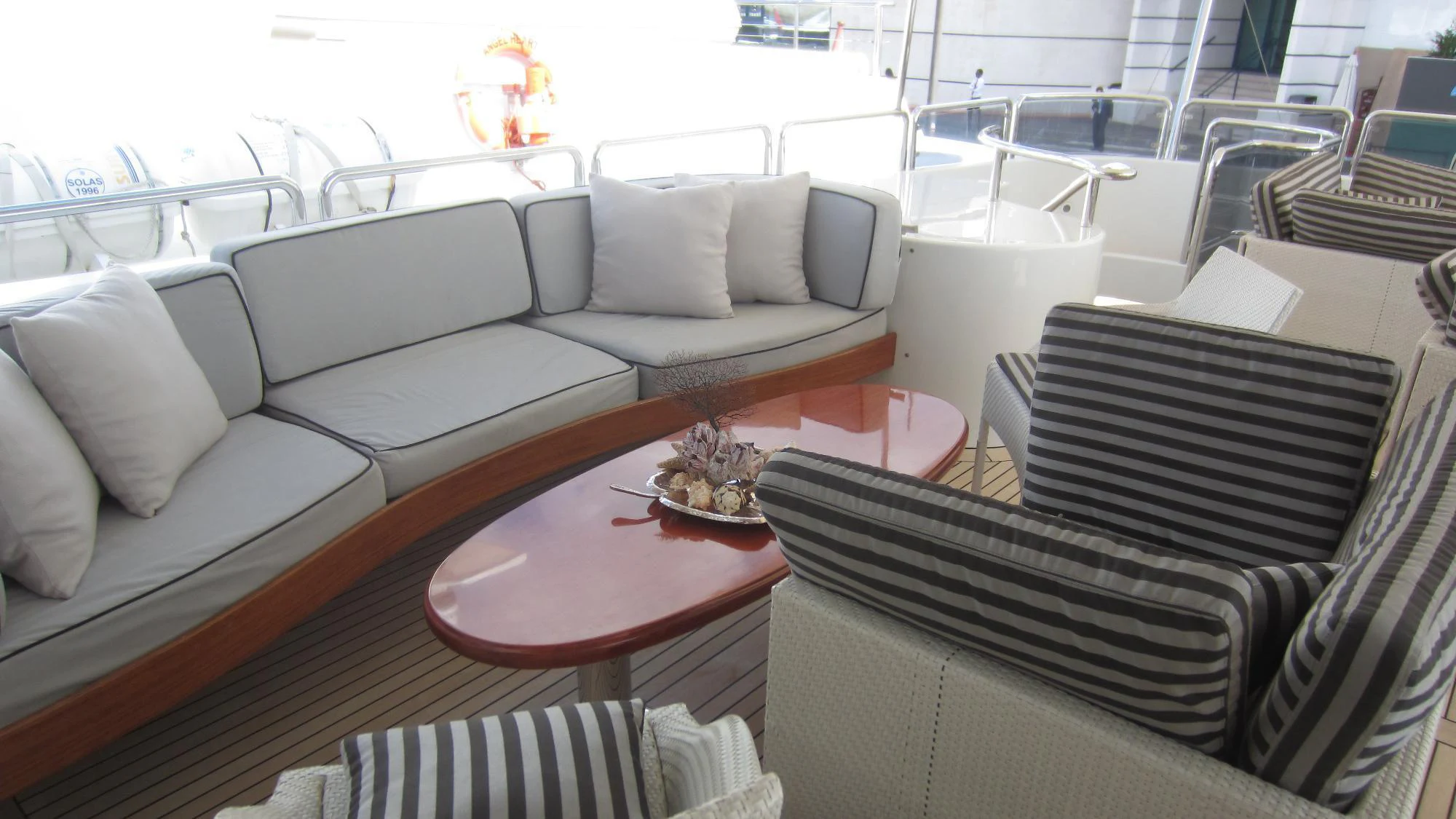a living room with a large window aboard SATINE Yacht for Charter