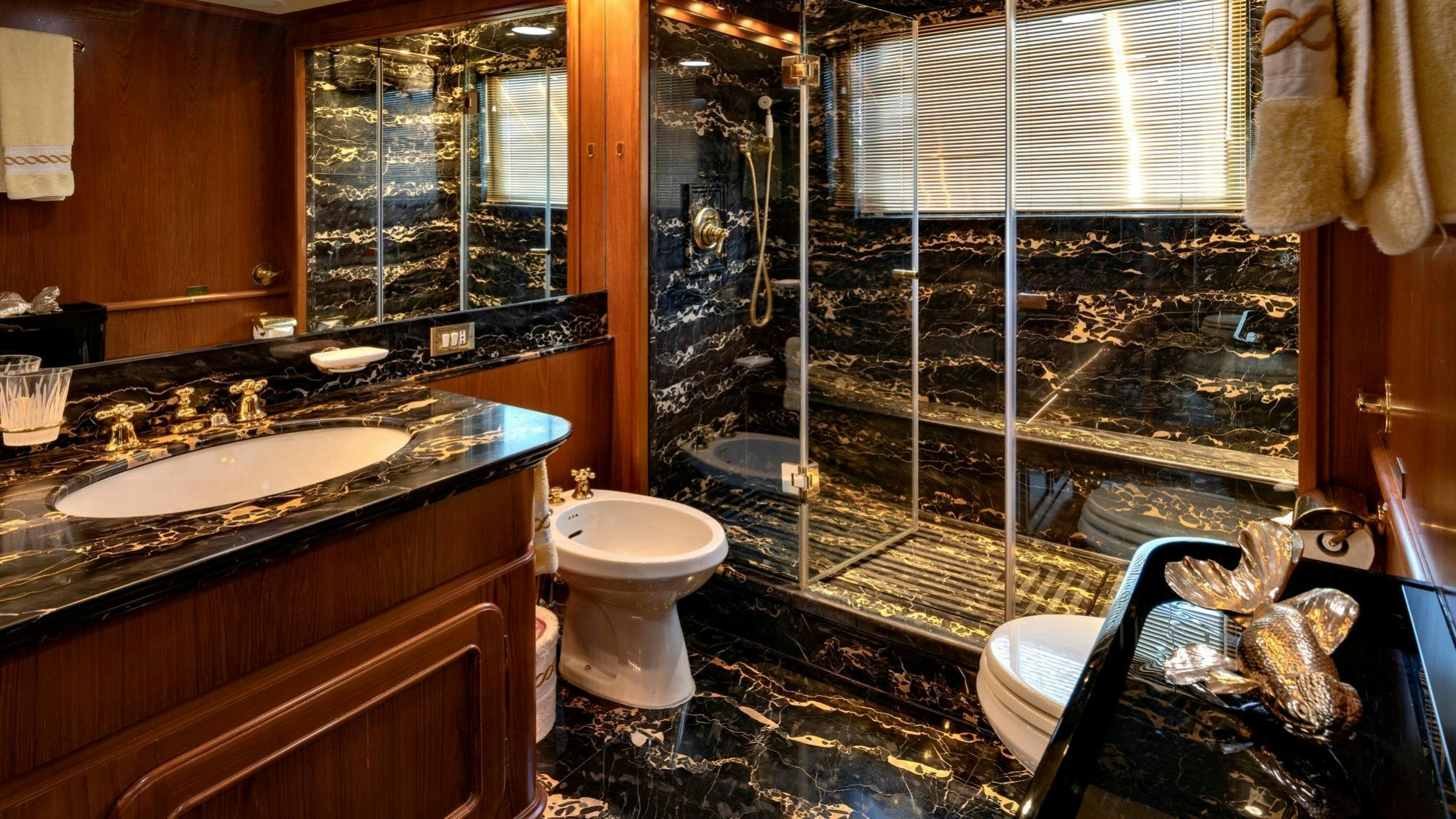 a bathroom with a glass shower aboard NIGHTFLOWER Yacht for Charter