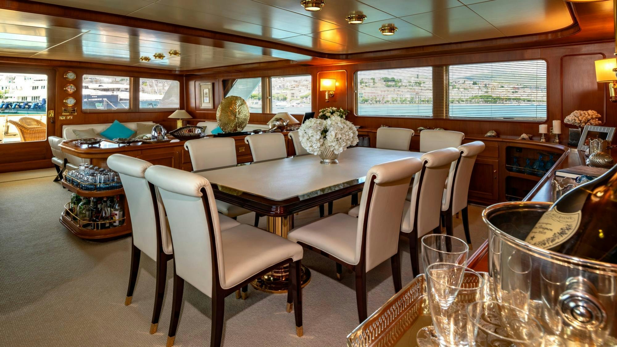 a restaurant with tables and chairs aboard NIGHTFLOWER Yacht for Charter